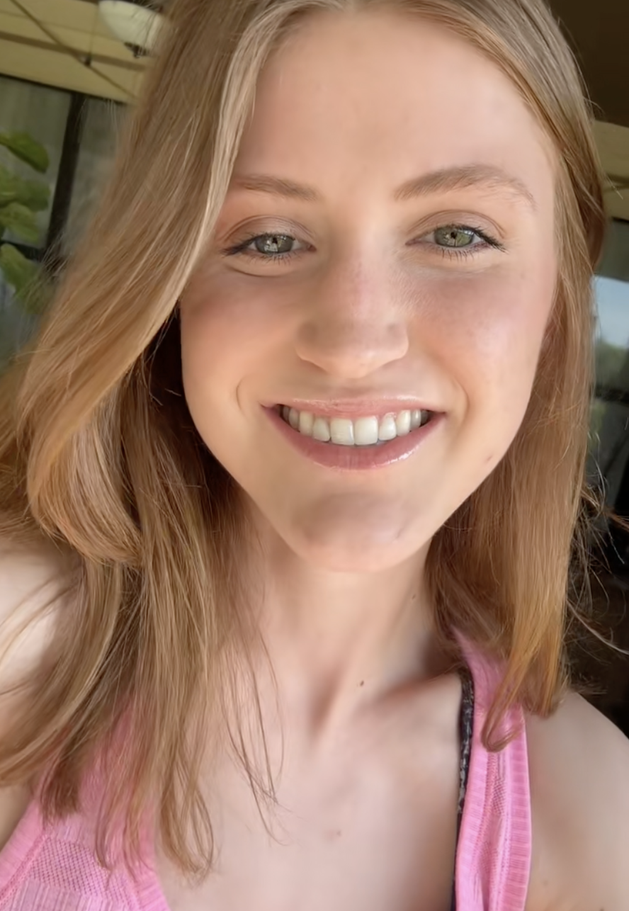 In bright natural light, Virginia Elder smiles wide in a pink tank top, her recovery fully visible. | Source: TikTok/virginiaeelder