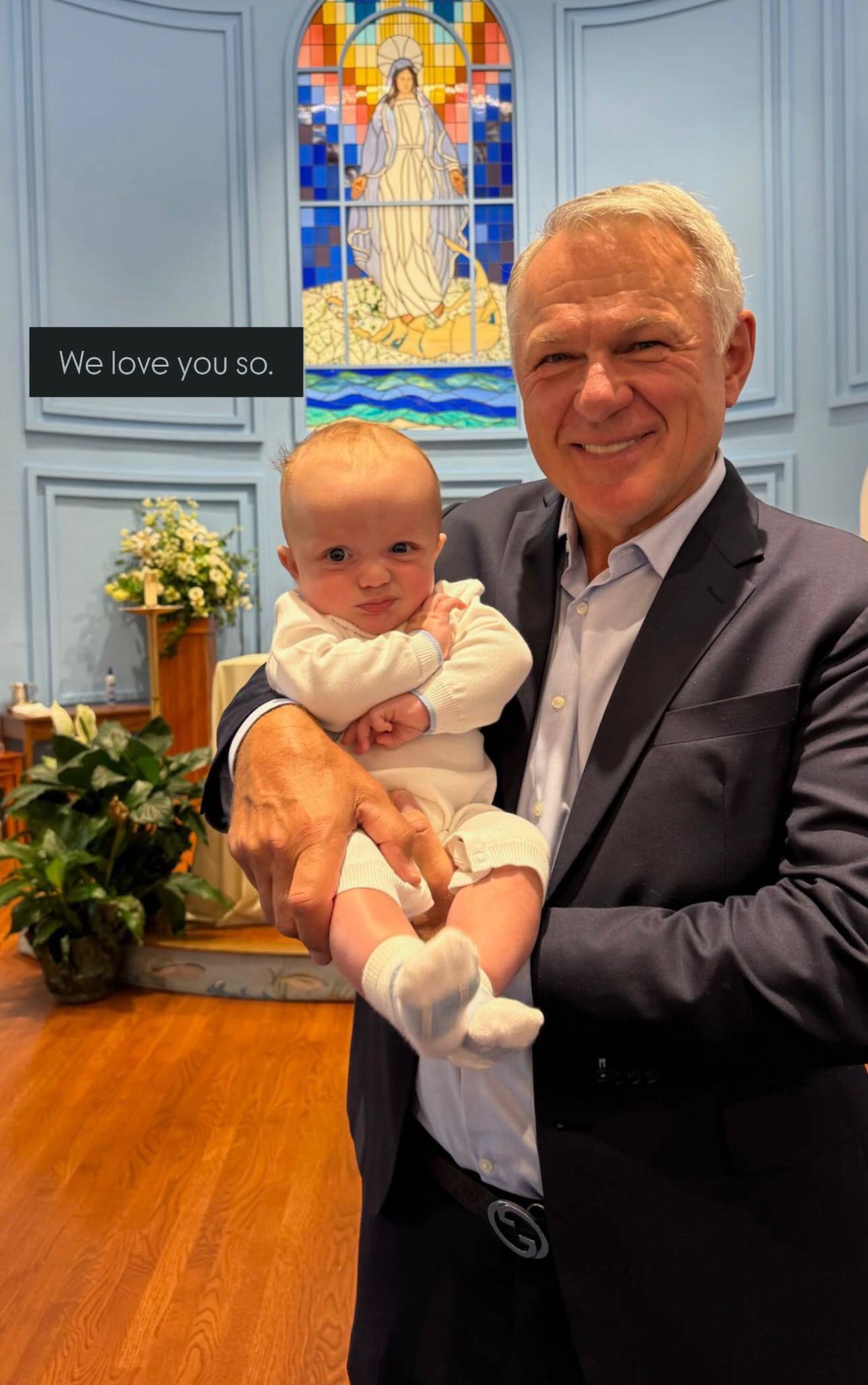 Claude Lemieux smiles while holding a young child during a church celebration in a photo shared by Brookie. | Source: Instagram Story/brookiemon