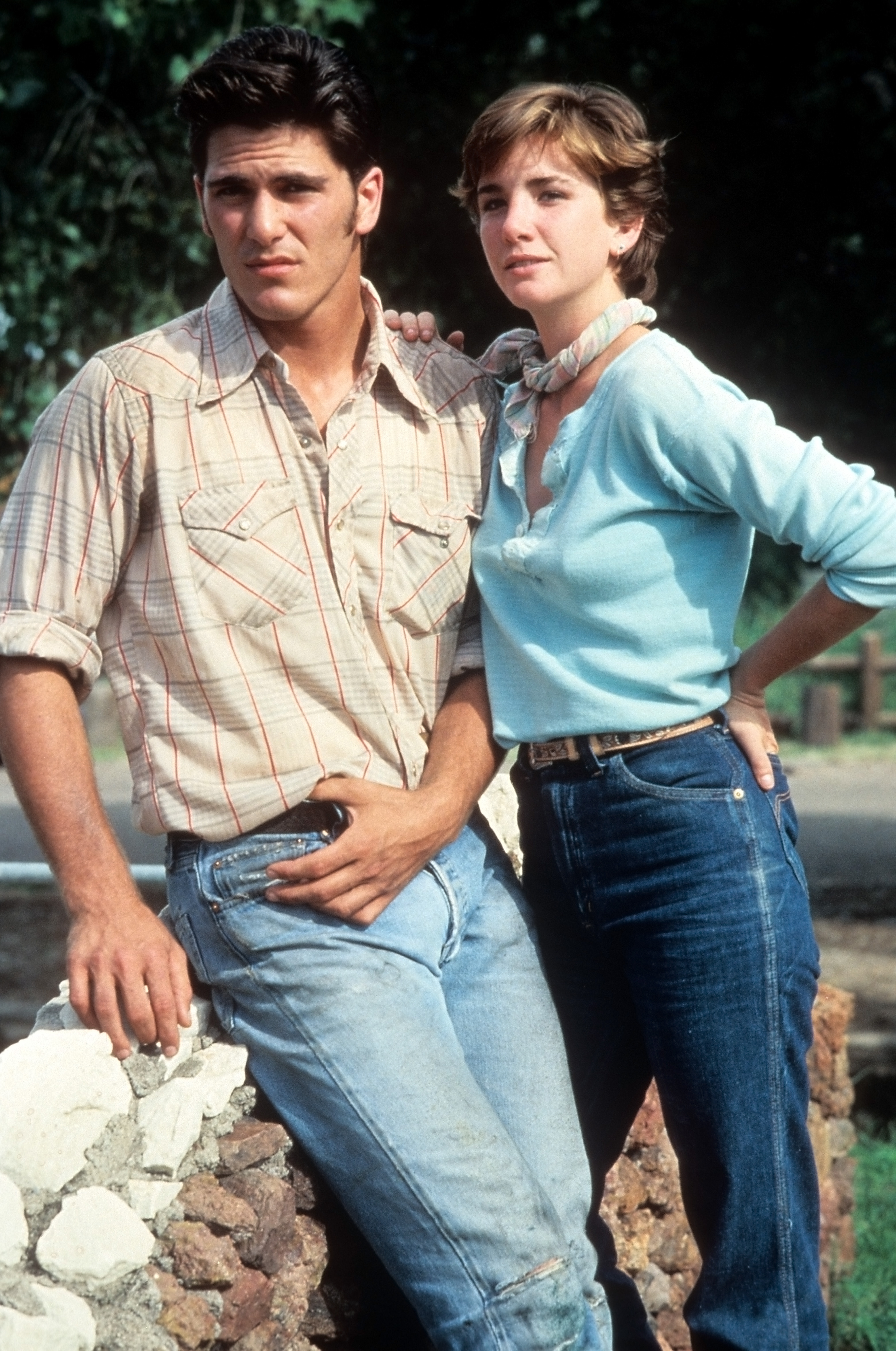 Michael Schoeffling appeared alongside Melissa Gilbert in a scene from the 1985 drama "Sylvester," with the co-stars pictured together against the film's rural backdrop. Schoeffling played ranch hand Matt opposite Gilbert's Charlie, a young woman determined to turn a horse into a champion, giving the rising actor another prominent role one year after "Sixteen Candles" made him widely recognizable as Jake Ryan.