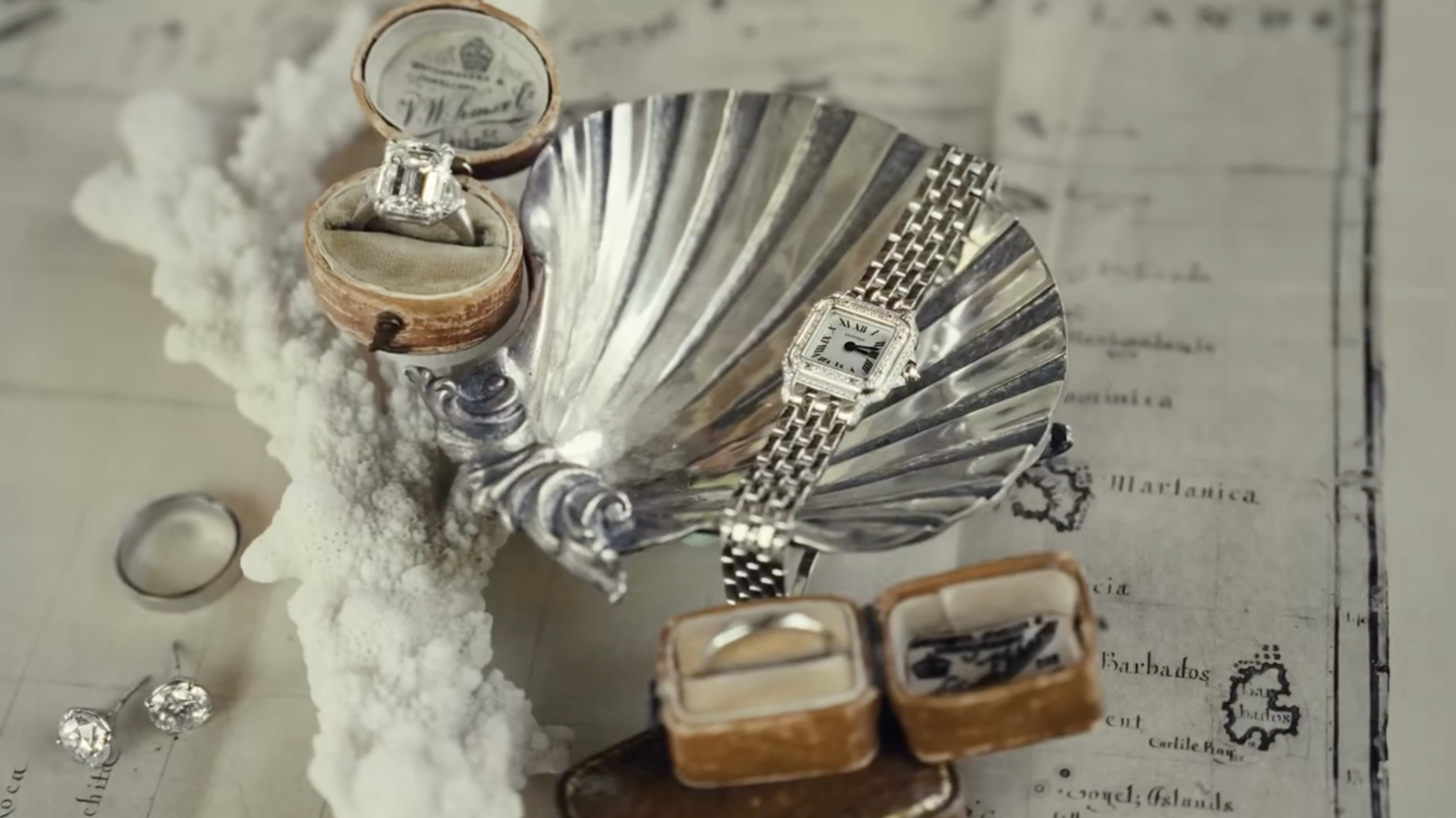 Wedding keepsakes, including rings, cuff links and a luxury watch, are displayed atop a vintage Caribbean map before the ceremony. | Source: Instagram/donaldjtrumpjr