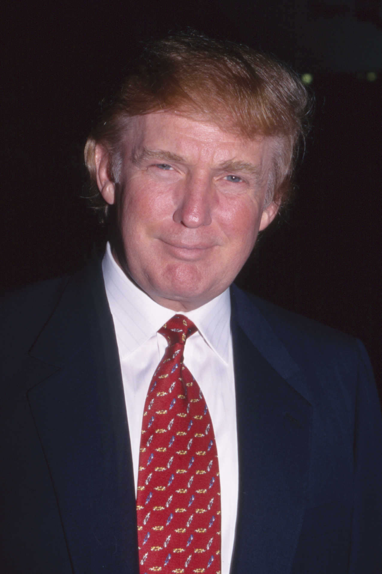 Donald Trump's hair takes on a lighter, reddish-brown shade while retaining its familiar swept style at the NYC 2000 fashion show in Times Square on September 13, 1999.