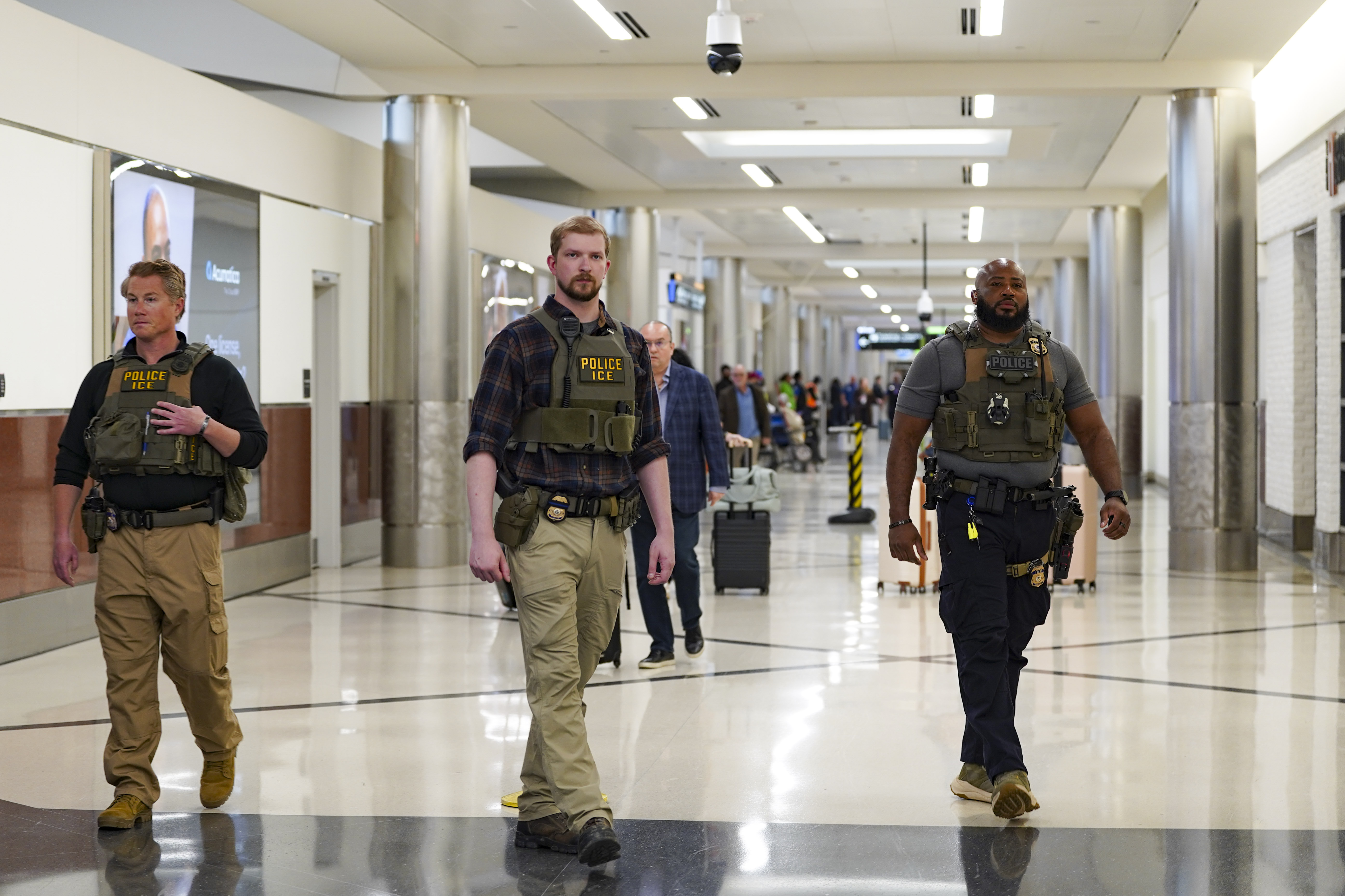 ICE agents walk around Atlanta Hartsfield-Jackson International Airport on March 25, 2026 | Source: Getty Images