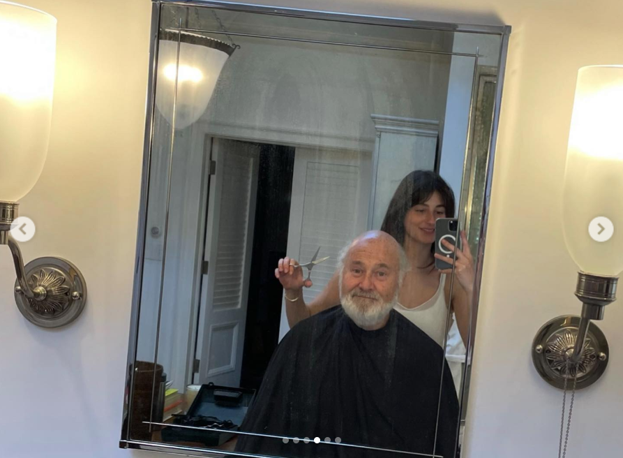 A bathroom mirror selfie shows a light-hearted moment between Rob Reiner and his daughter Romy, as she gives him a haircut, from a post dated March 6, 2022. | Source: Instagram/romyreiner