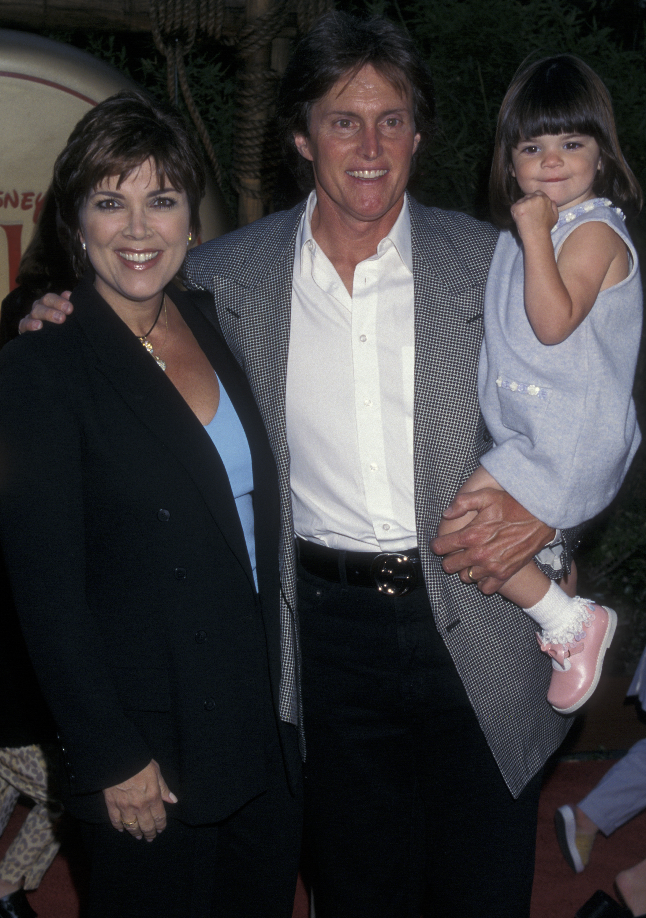 Kris Jenner poses with Bruce Jenner and their daughter Kendall at a Mulan screening at the Hollywood Bowl in Hollywood, California, on June 5, 1998. | Source: Getty Images