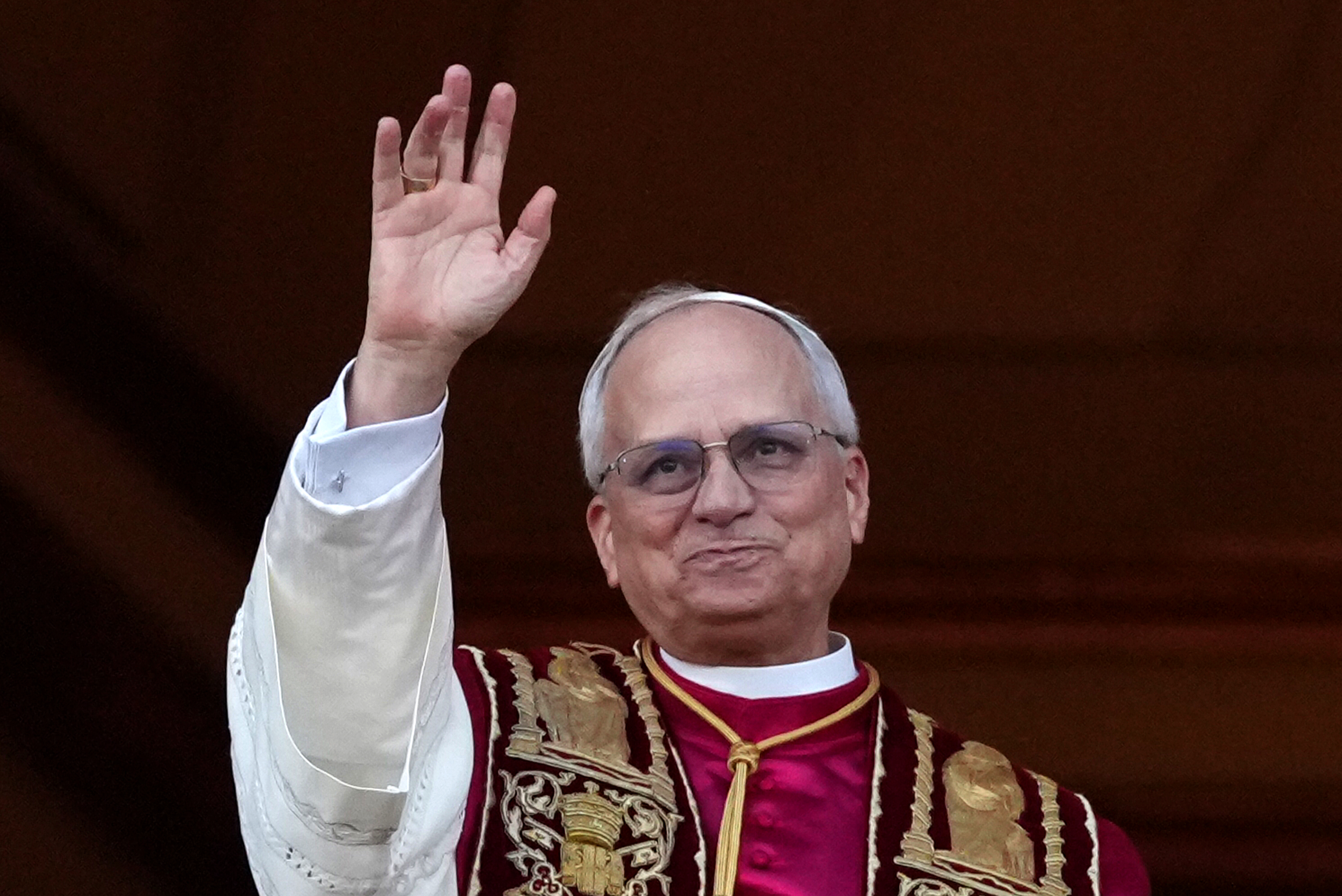 Pope Leo XIV smiles as he greets the crowd from the Vatican balcony on May 8, 2025 | Source: Getty Images