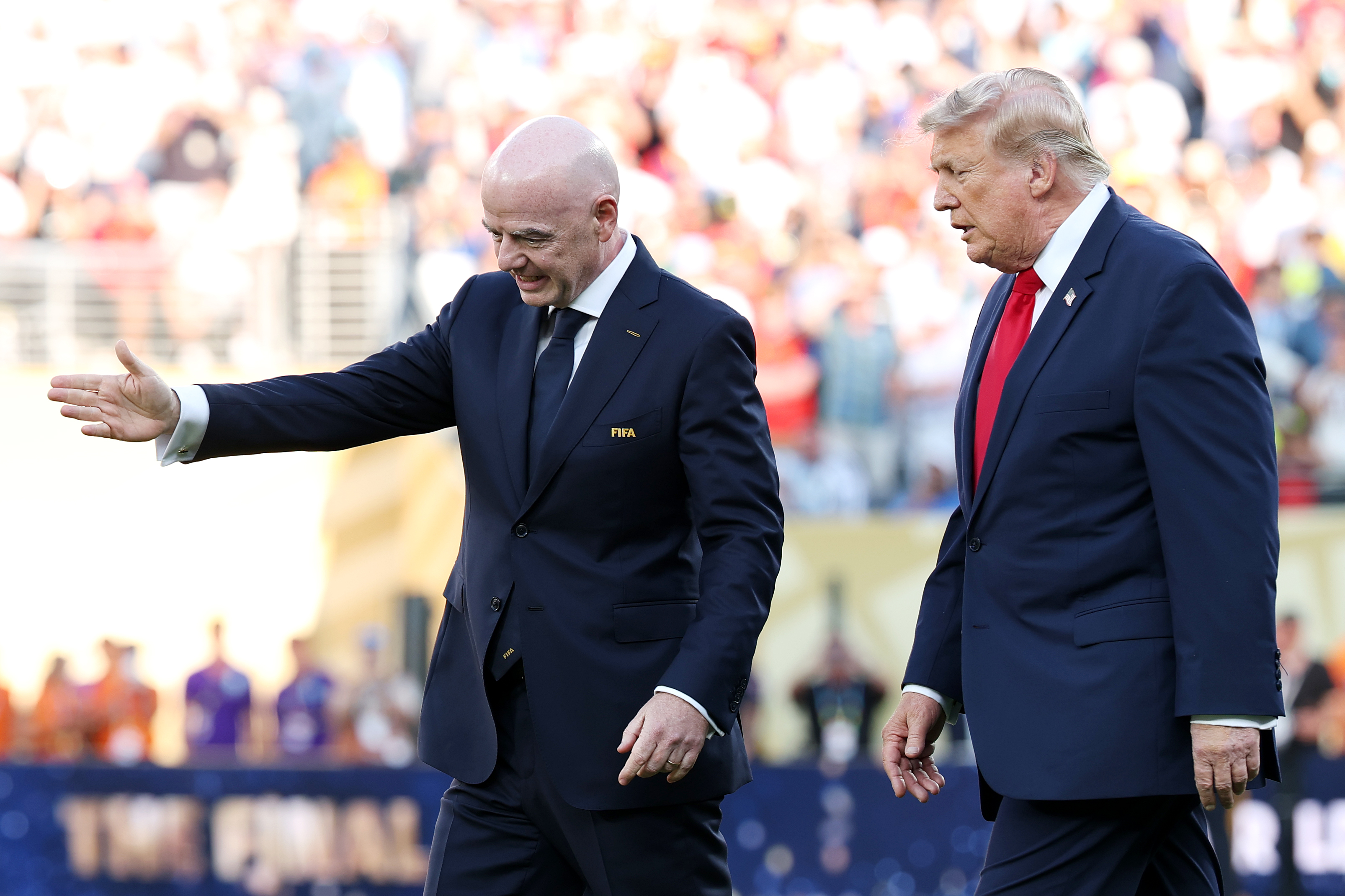 Gianni Infantino appeared to guide Trump away after the formal presentation had ended, prompting viewers to debate whether the moment reflected a missed cue or unclear staging. The brief exchange became one of the final's most replayed unscripted moments. | Source: Getty Images