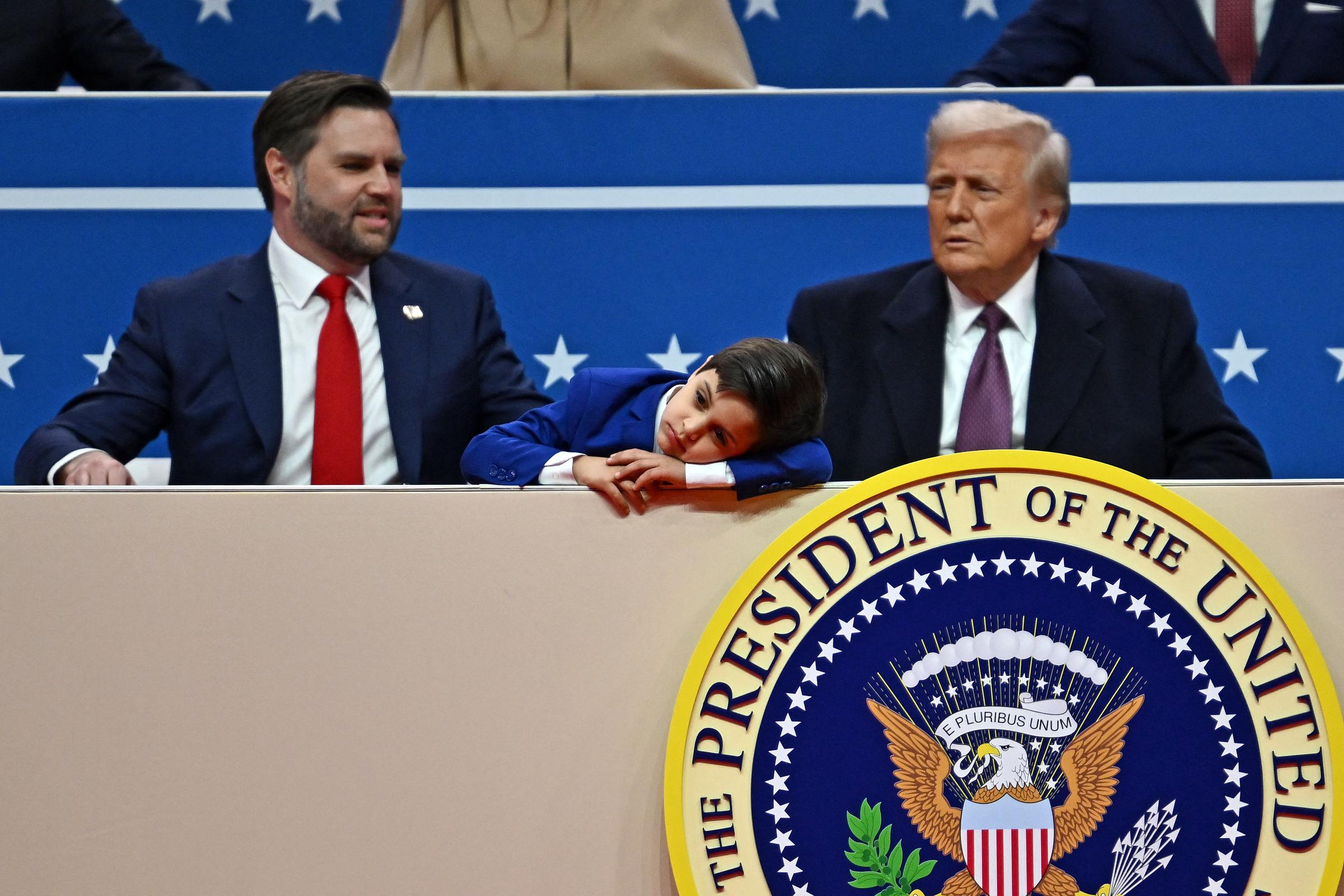 President Donald Trump and Vice President J.D. Vance, alongside one of Vance's children, attend the inaugural parade inside Capital One Arena, in Washington, DC, on January 20, 2025. | Source: Getty Images