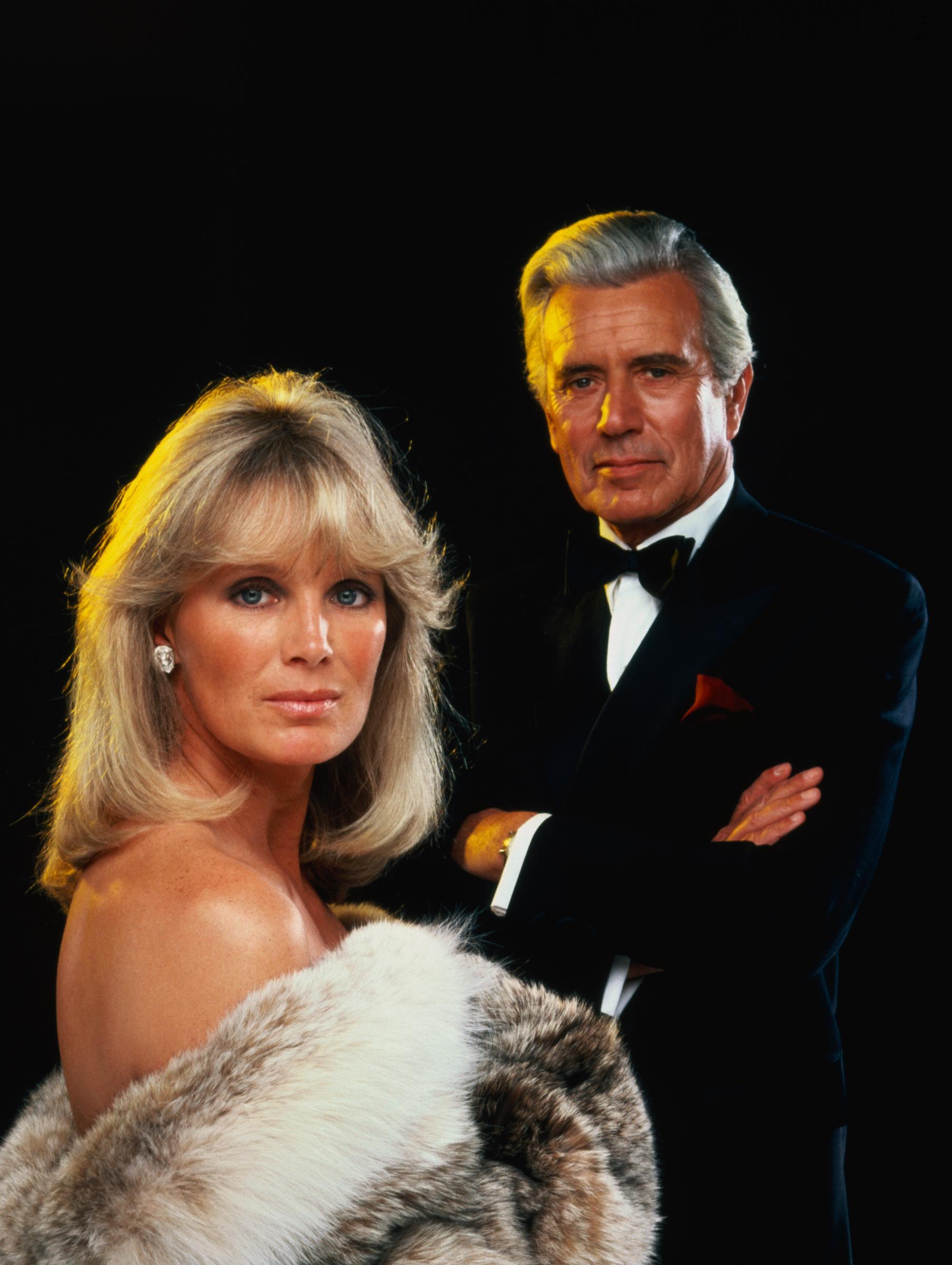 Linda Evans and John Forsythe on the set of "Dynasty," 1981 | Source: Getty Images