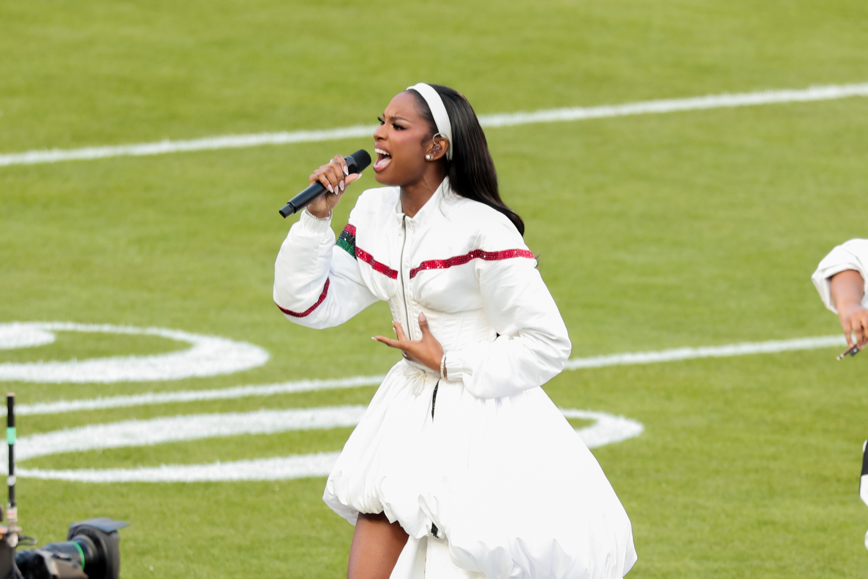 Coco Jones singing her heart out to the 2026 Super Bowl crowd. | Source: Getty Images