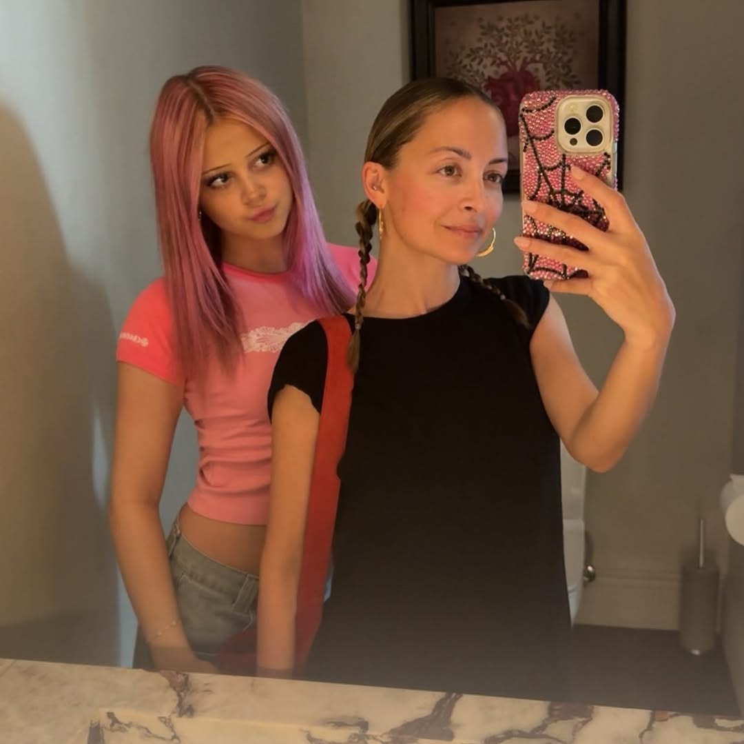 Nicole Richie poses for a mirror selfie with teenage Harlow Winter Kate Madden standing beside her. With long pink hair and a fitted pink top, Kate appears older in the stylish mother-daughter snapshot.| Source: Instagram/nicolerichie and joelmadden