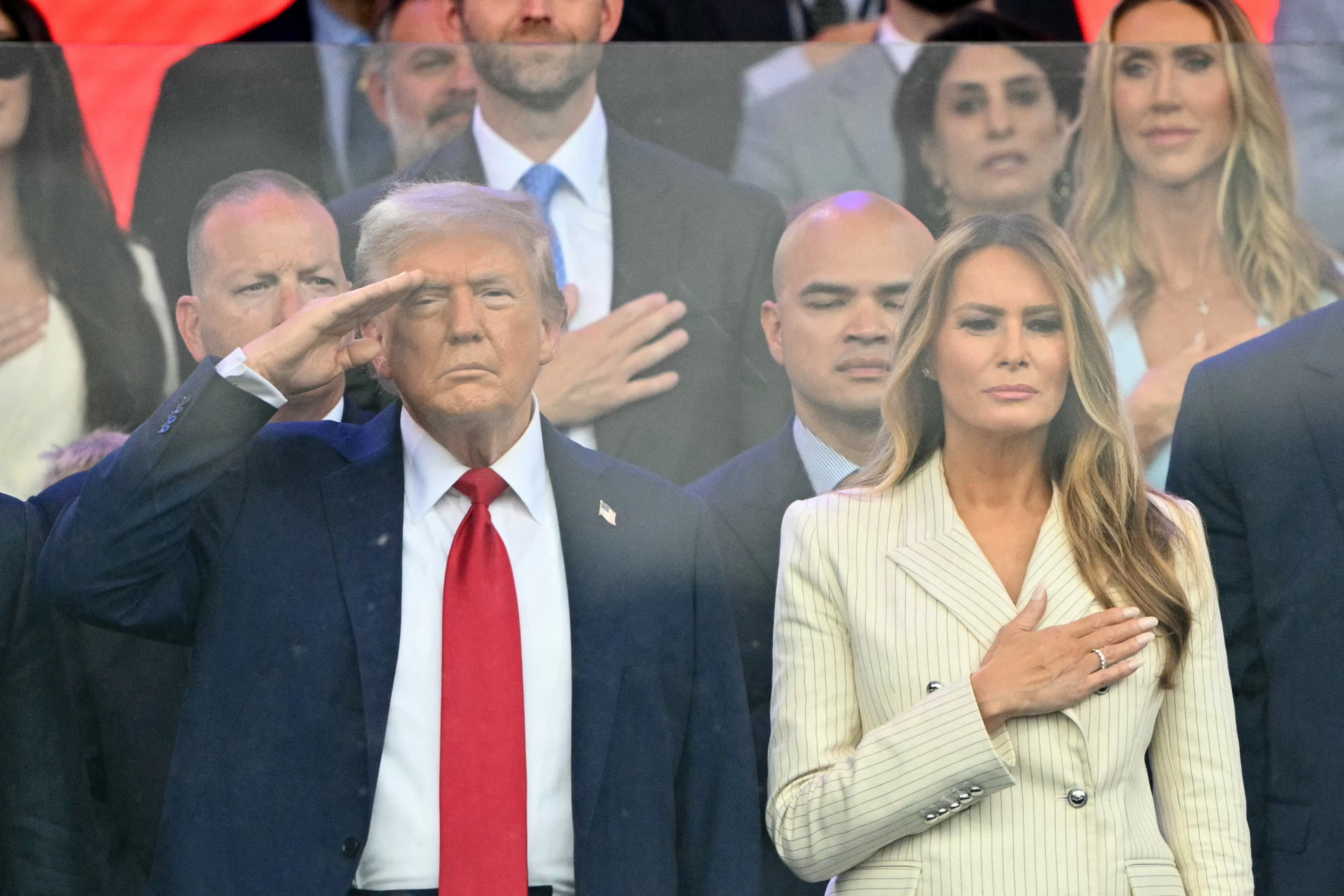 Donald Trump salutes next to Melania Trump during the Army 250th Anniversary Parade | Source: Getty Images