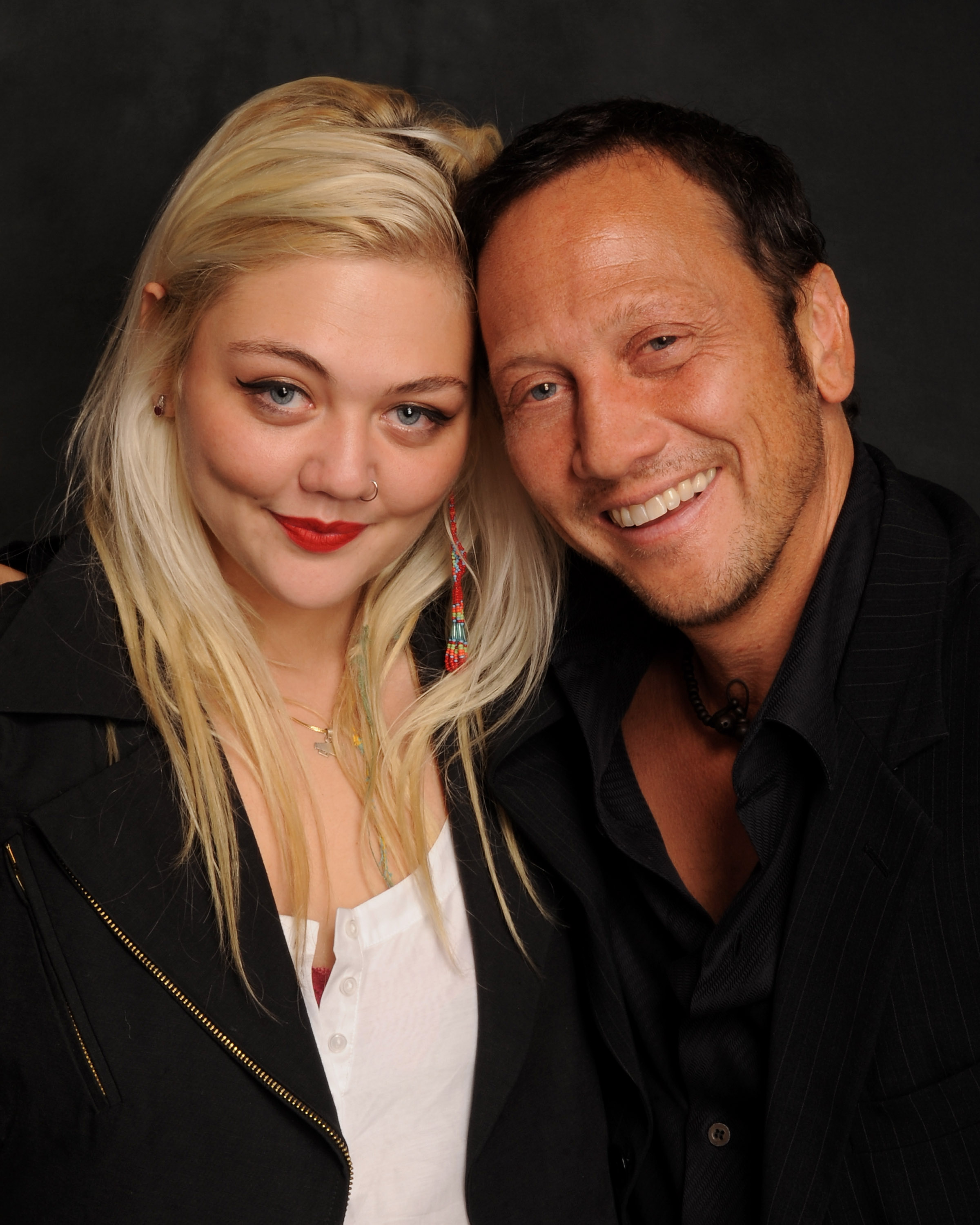 Elle King poses with her father, comedian Rob Schneider, early in her career. King later built her music career using her mother's surname rather than Schneider. | Source: Getty Images