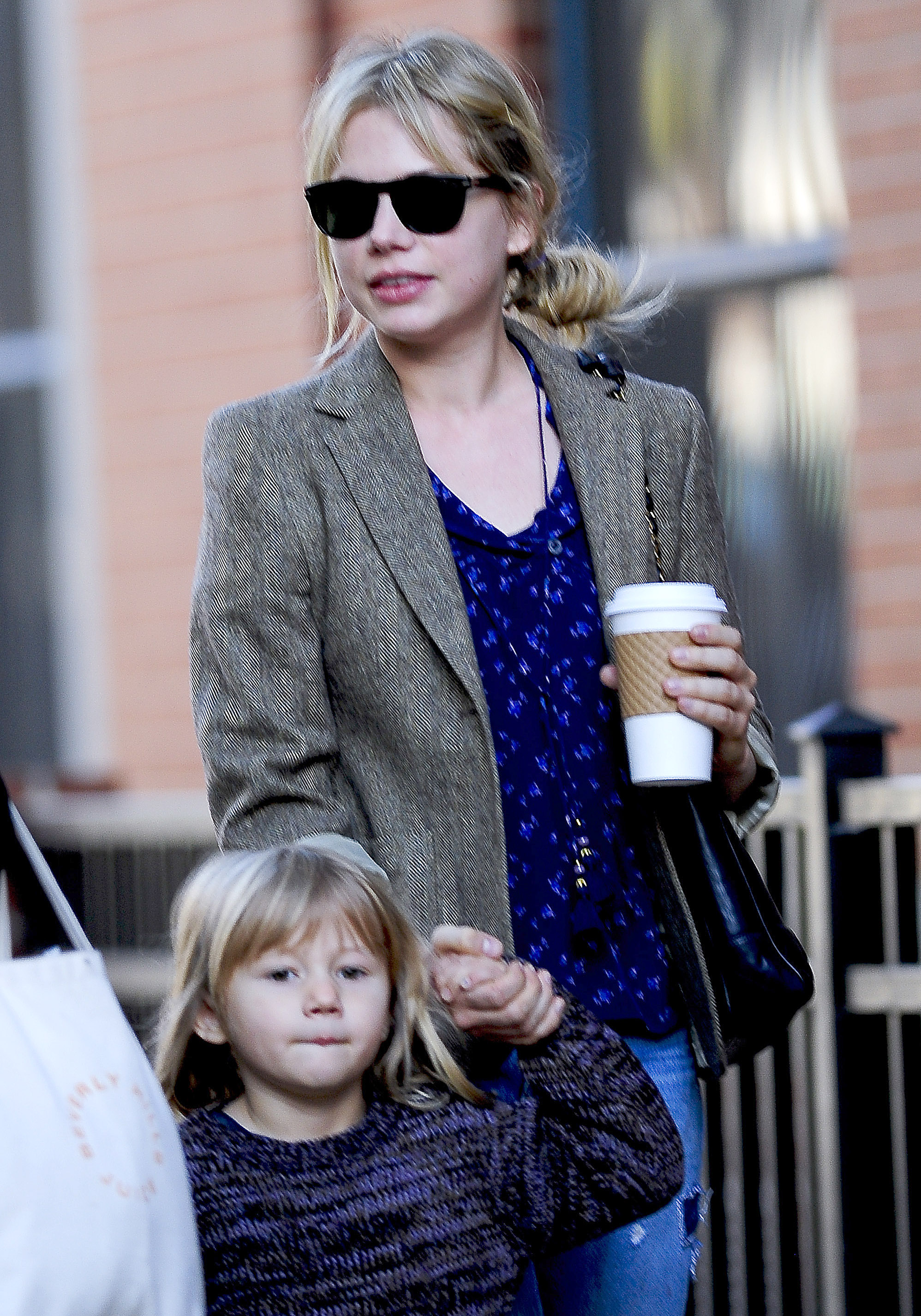 Michelle Williams is photographed walking through Brooklyn, New York, with daughter Matilda Ledger on October 30, 2009. By then, Williams had focused on giving Ledger a stable upbringing following Heath Ledger's death the previous year, raising her largely away from the public spotlight.