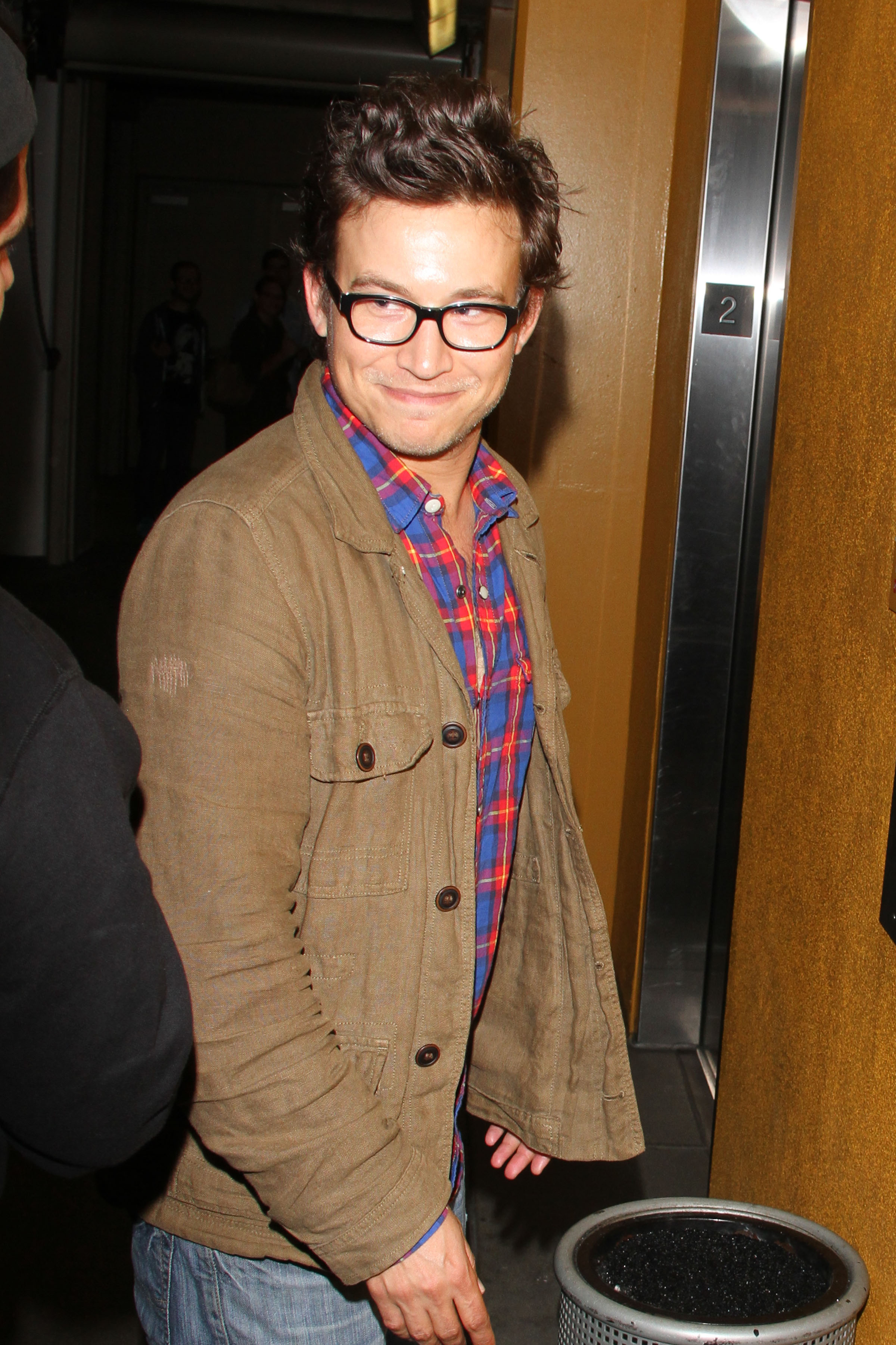 Jonathan Taylor Thomas looked markedly different from the child star audiences remembered when he was seen in Los Angeles, California, on August 14, 2013. Wearing black-framed glasses, a plaid shirt, and a casual brown jacket, the former "Home Improvement" actor was photographed during the same period in which he briefly returned to television on "Last Man Standing," years after stepping away from the intense fame of his youth.