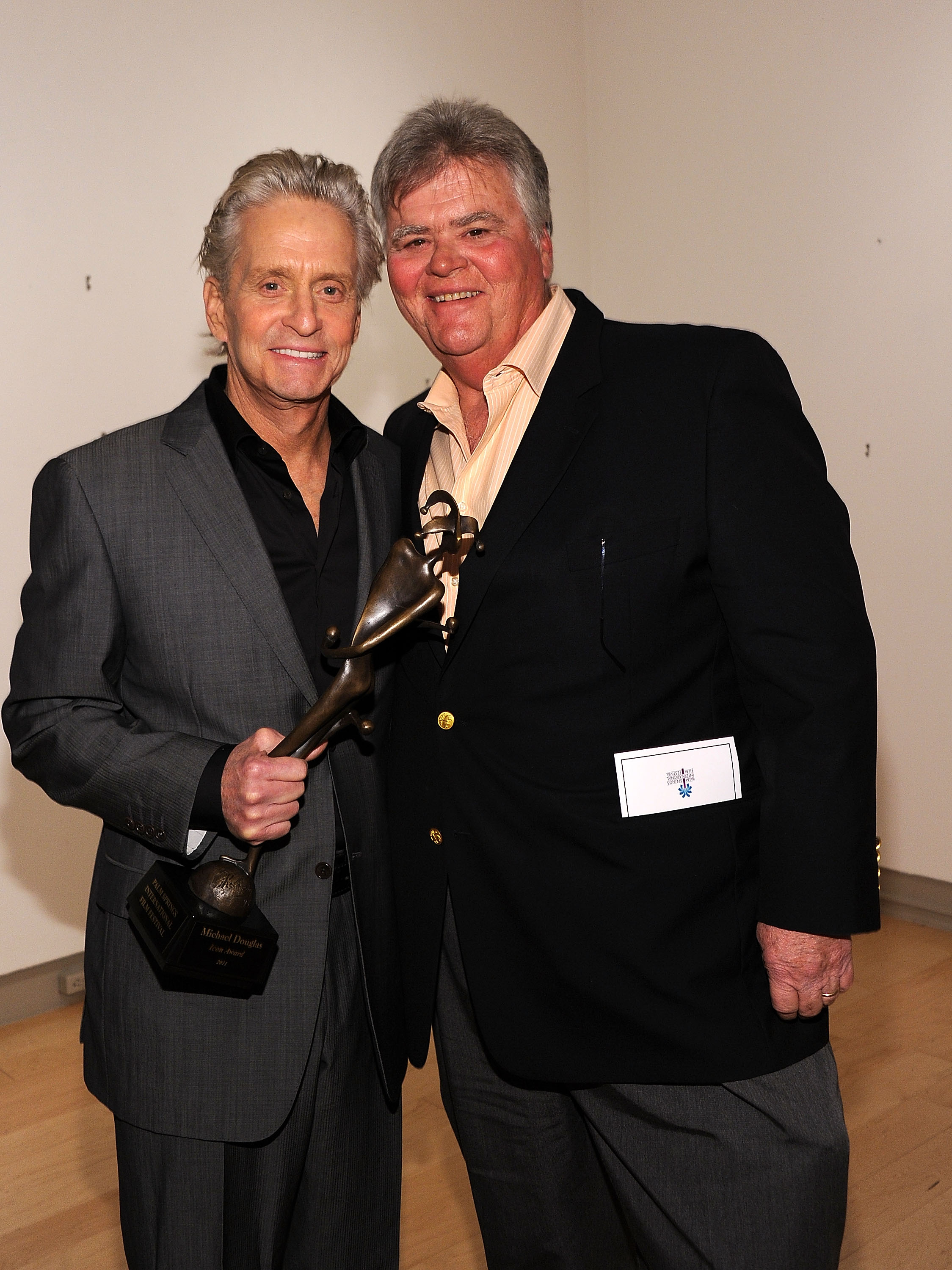 Michael reunites with his brother, Joel, at the Palm Springs International Film Festival in 2011. The brothers once called the much simpler Westport property home, where Michael said he lived between 1956 and 1963. | Source: Getty Images