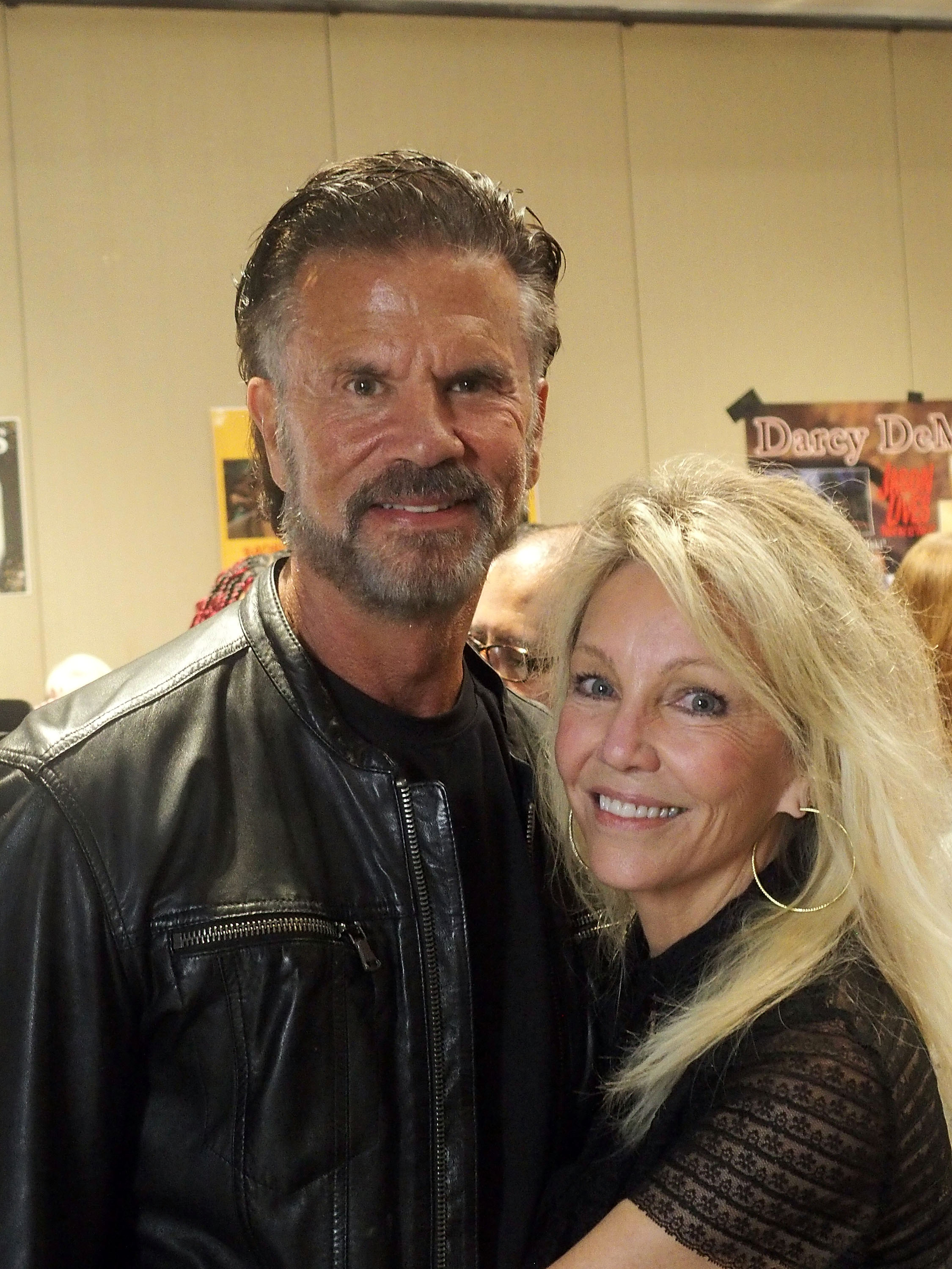 Lorenzo Lamas and Heather Locklear pose closely together while attending the Chiller Theatre Expo Spring 2026 at the Hilton Parsippany in Parsippany, New Jersey, on April 26, 2026. Making their first major public appearance as a couple, the pair smile warmly in coordinating black ensembles, with Lamas in a black leather moto jacket and Locklear leaning in while wearing a delicate lace top, gold hoop earrings, and layered blonde waves. | Source: Getty Images