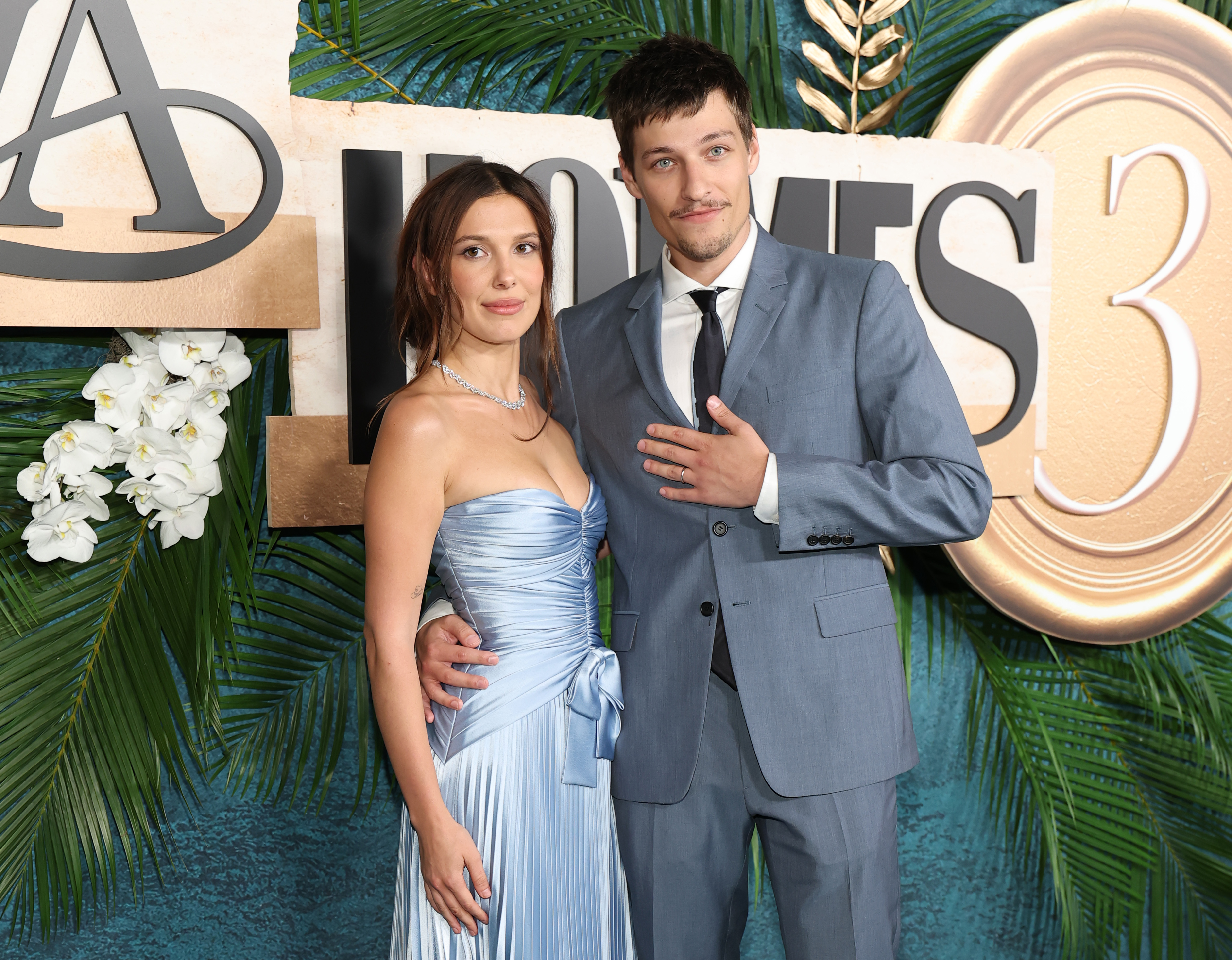 Millie Bobby Brown and Jake Bongiovi attended the "Enola Holmes 3" world premiere in New York City on June 25, 2026. Months later, an Instagram post from their Dolomites trip drew fresh attention after Bongiovi appeared with a baby carrier strapped across his chest. | Source: Getty Images