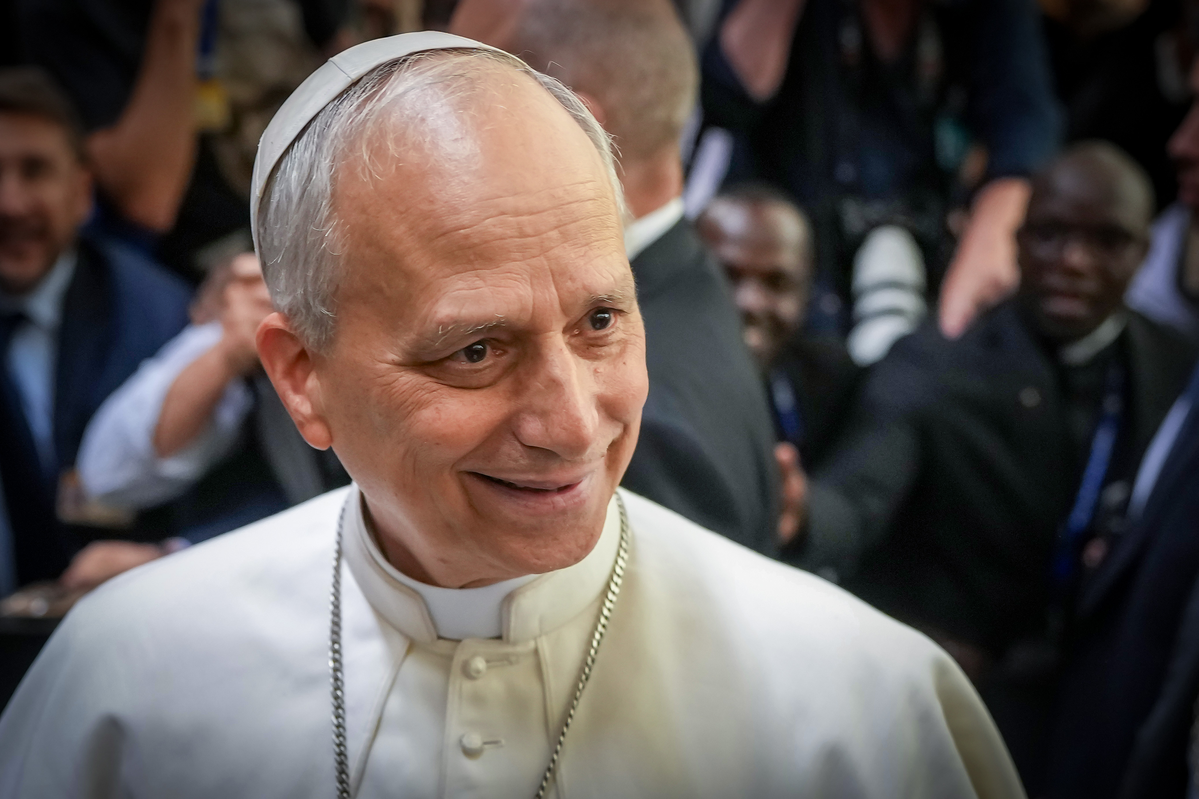 Pope Leo XIV shakes hands and greets people of the press after an audience with thousands of journalists and media workers on May 12, 2025, at Paul VI Hall in Vatican City | Source: Getty Images