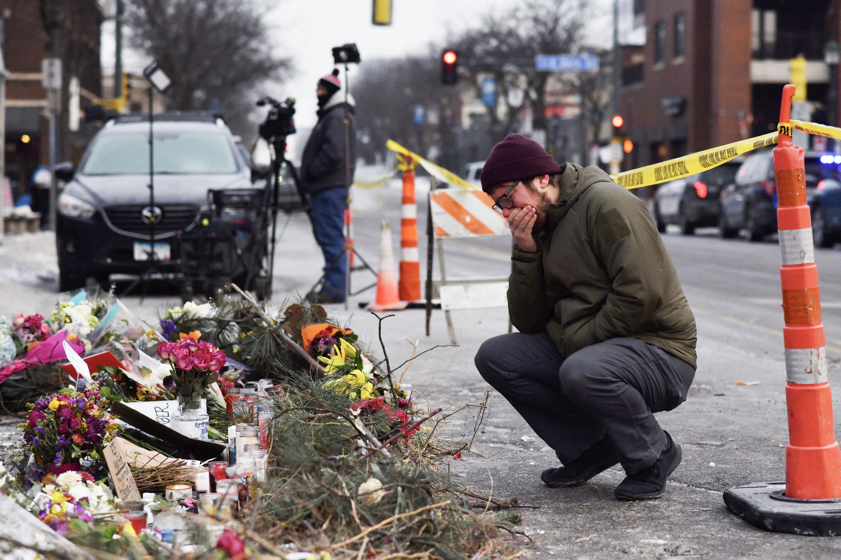 A mourner visits a makeshift memorial for Alex Pretti on January 25, 2026 in Minneapolis, Minnesota. | Source: Getty Images