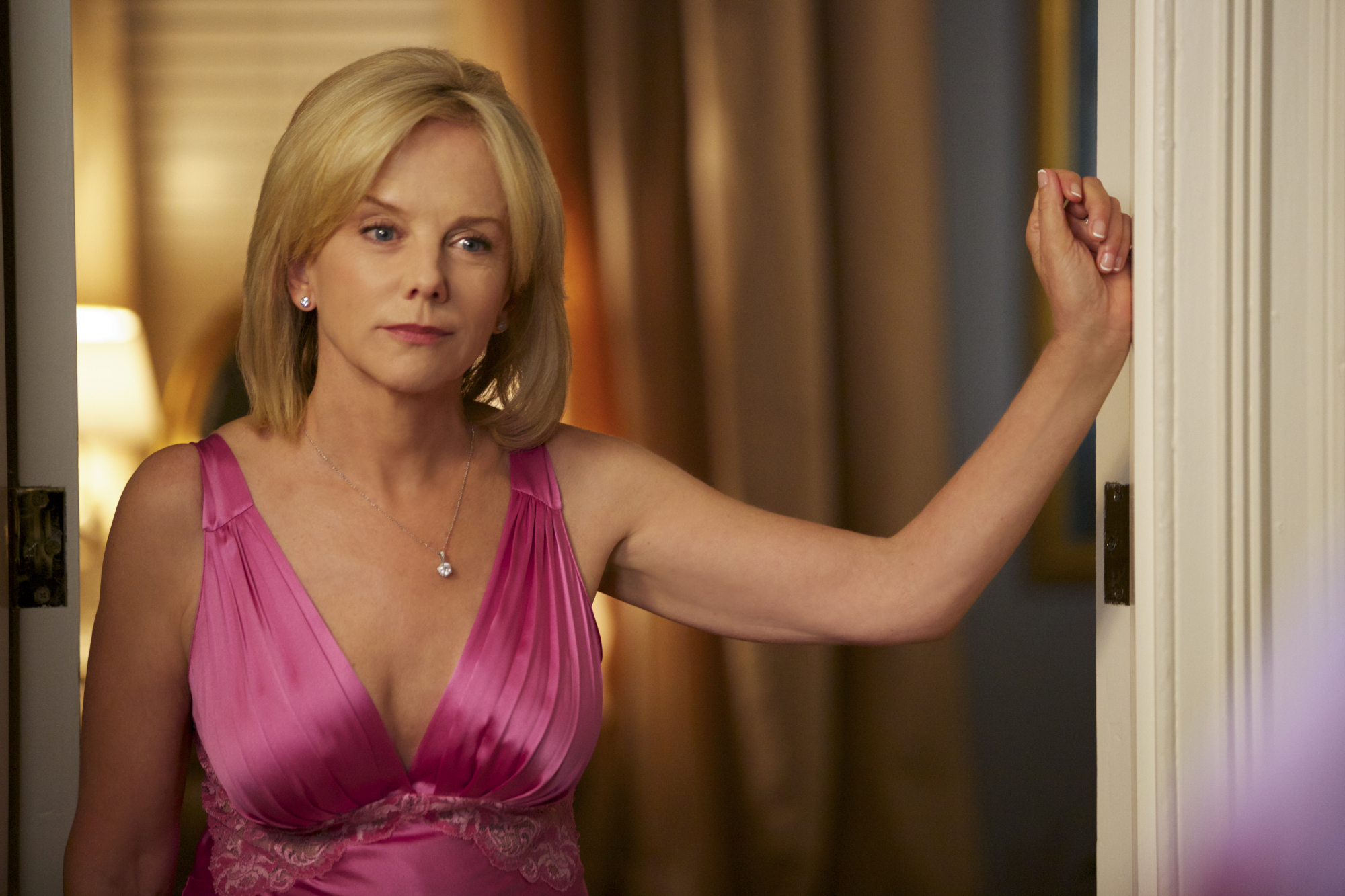 Years of graceful aging had etched subtle maturity around her eyes and jawline by the time Linda Purl appeared as Barbara Fortnum in the 2014 "Reckless" episode "Blind Sides". At 58, the actress radiated polished, Southern-matriarch poise in a plunging, magenta satin-and-lace chemise, her classic features framed by a sleek, shoulder-grazing blonde bob.