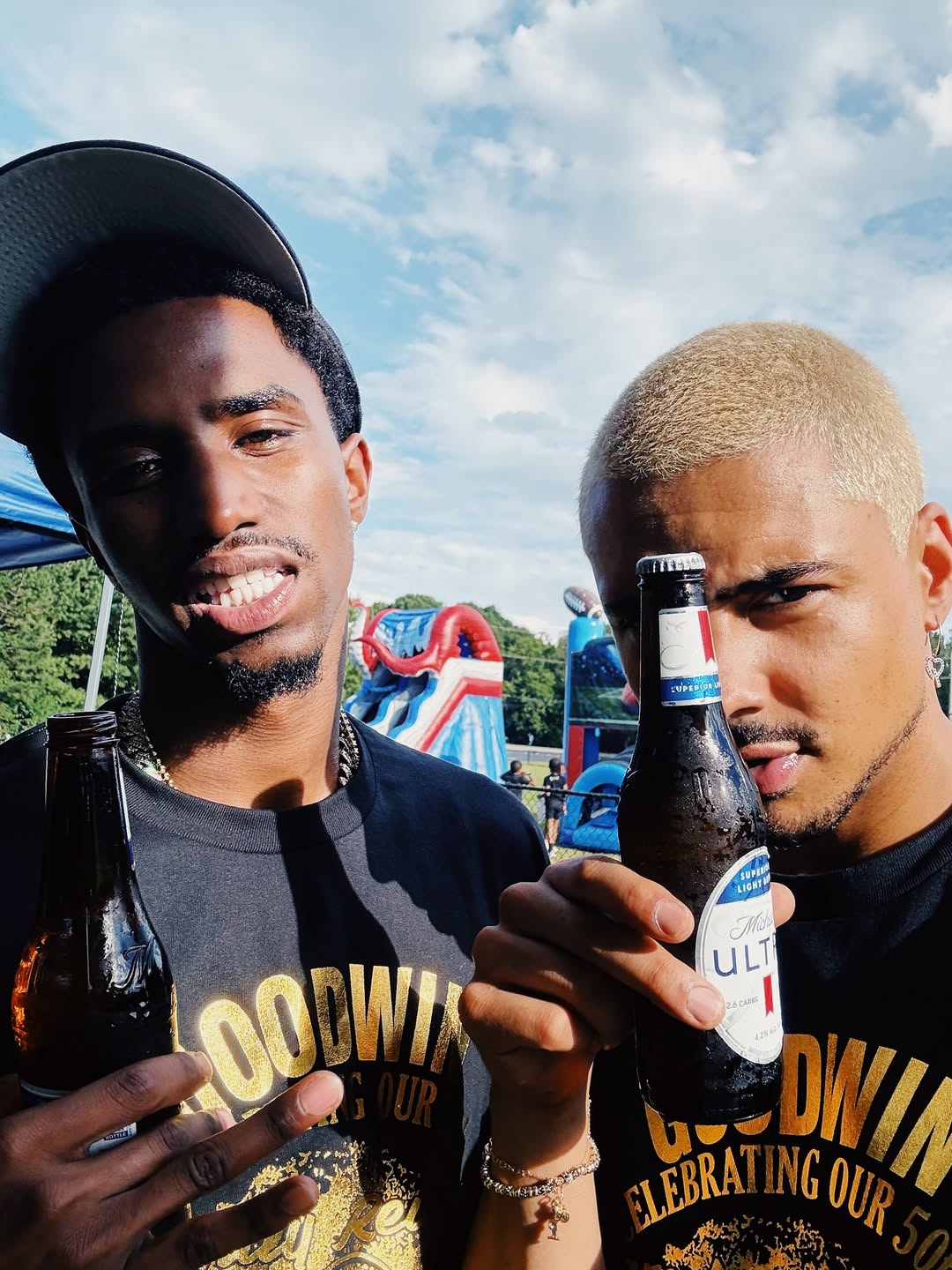 Christian and Quincy enjoy the sunny day with drinks in hand during the outdoor event, as posted on November 17, 2025 | Source: Instagram/quincy