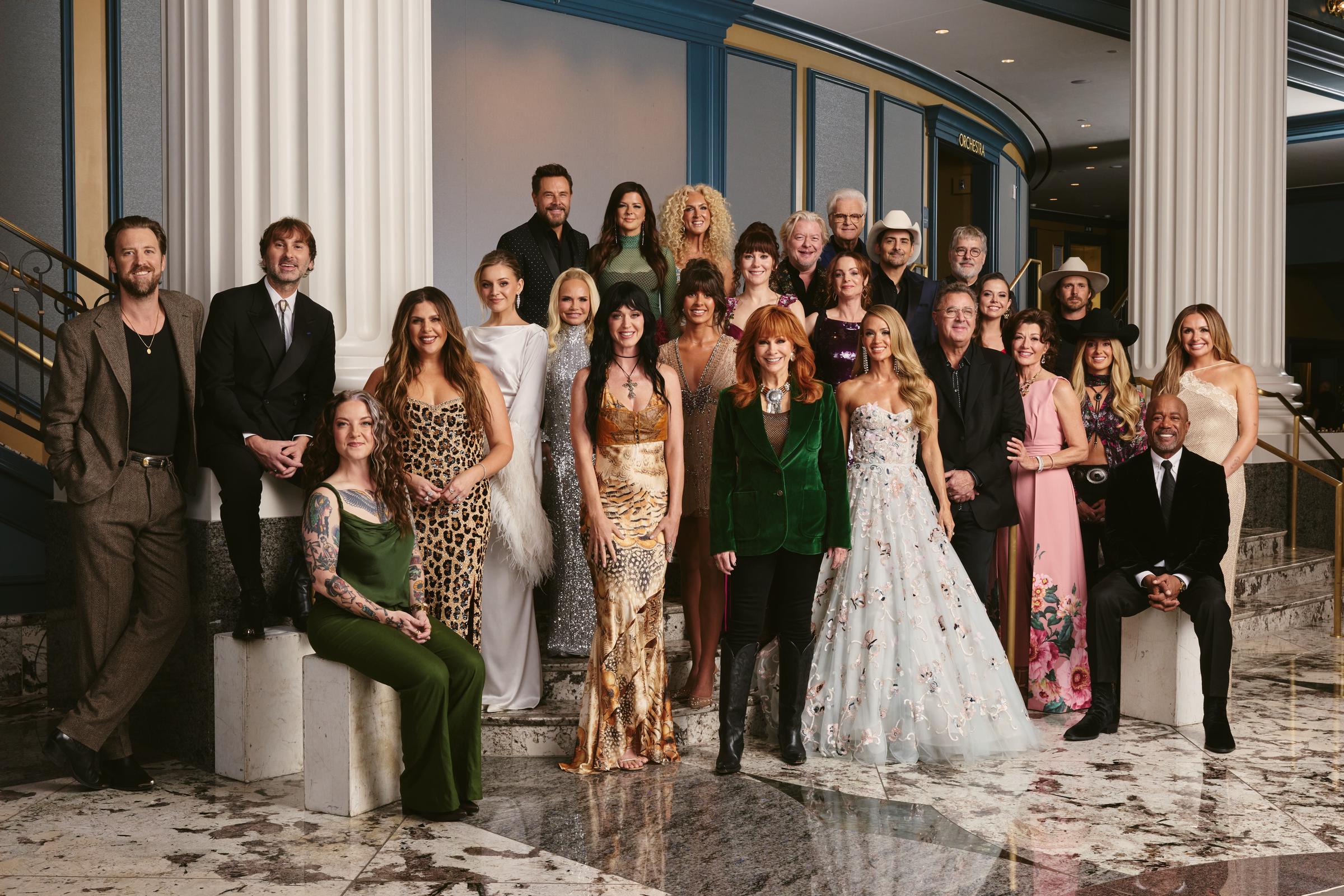 Reba McEntire joins Carrie Underwood, Katy Perry, Brad Paisley, Lainey Wilson, Darius Rucker, and other stars for a group portrait at the Nashville tribute to Dolly Parton. | Source: Getty Images