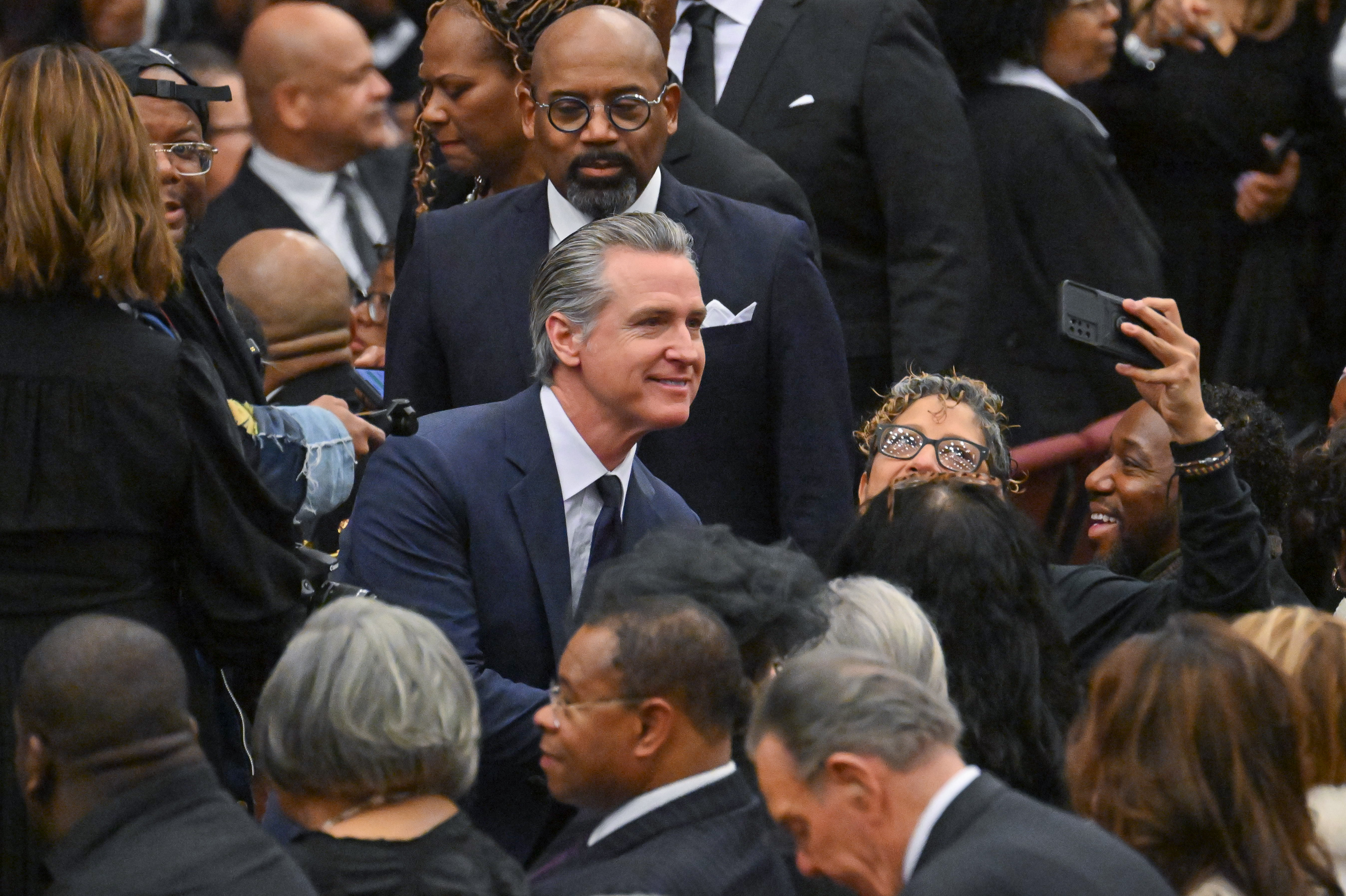 California Governor Gavin Newsom at the public memorial service for the late reverend. | Source: Getty Images