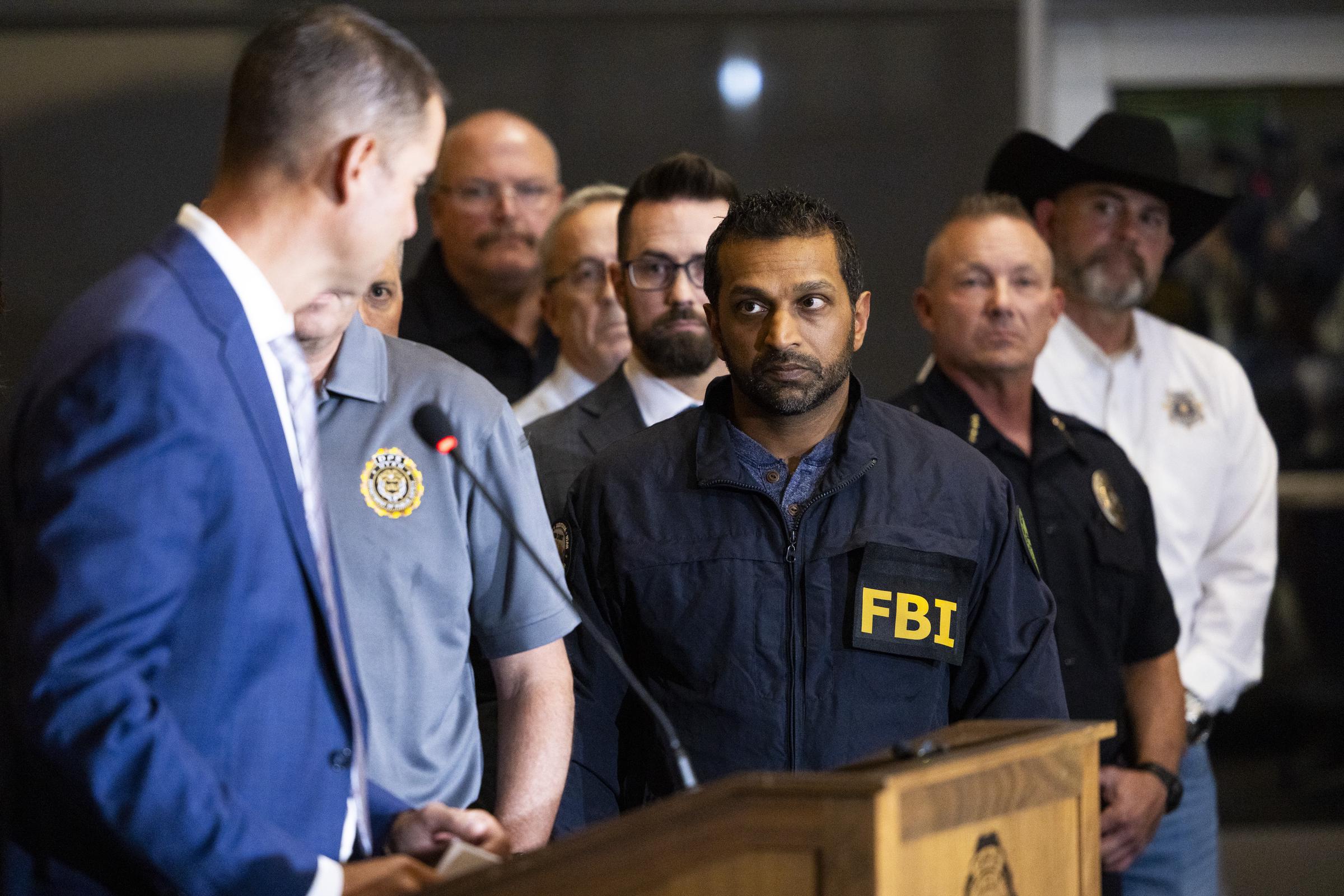 FBI director Kash Patel listens as Utah Department of Public Safety commissioner Beau Mason speaks during a press conference at Utah Valley University on September 11, 2025, in Orem, Utah | Source: Getty Images