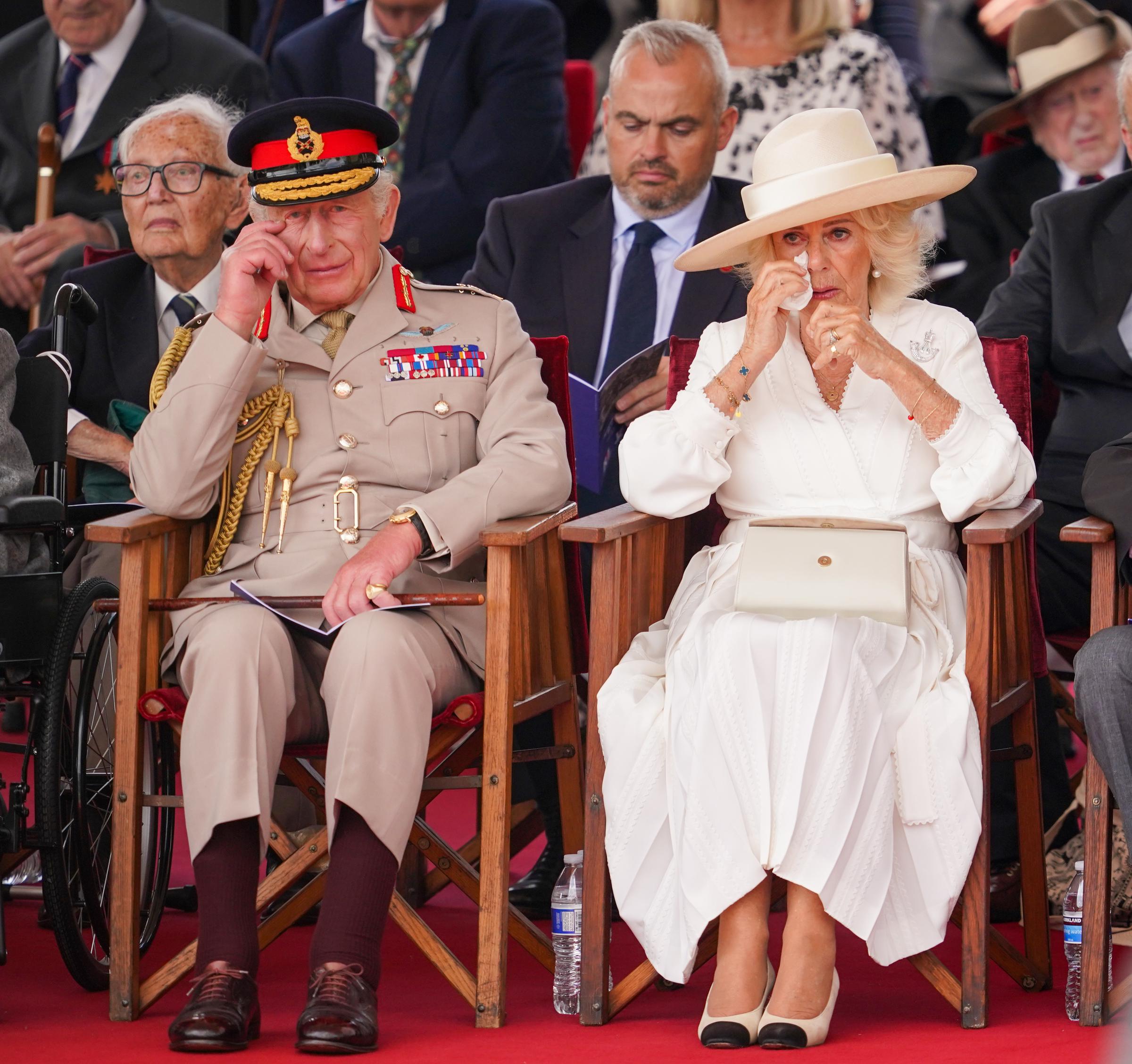 King Charles III and Queen Camilla react during a Service of Remembrance to commemorate the 80th Anniversary of VJ Day at The National Memorial Arboretum on August 15, 2025, in Alrewas, Staffordshire | Source: Getty Images