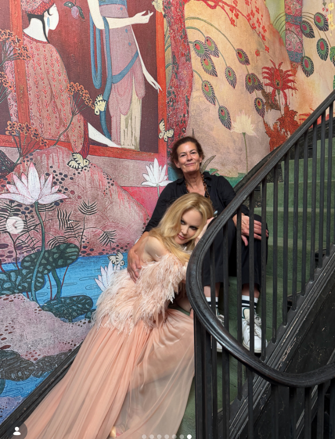Nicole Kidman shares a behind-the-scenes moment from her British Vogue cover shoot, posing on a staircase in a flowing gown as she celebrates her first-ever British Vogue cover. The milestone comes as she reflects on a difficult year and her decision to face what comes next with hope. | Source: Instagram/nicolekidman