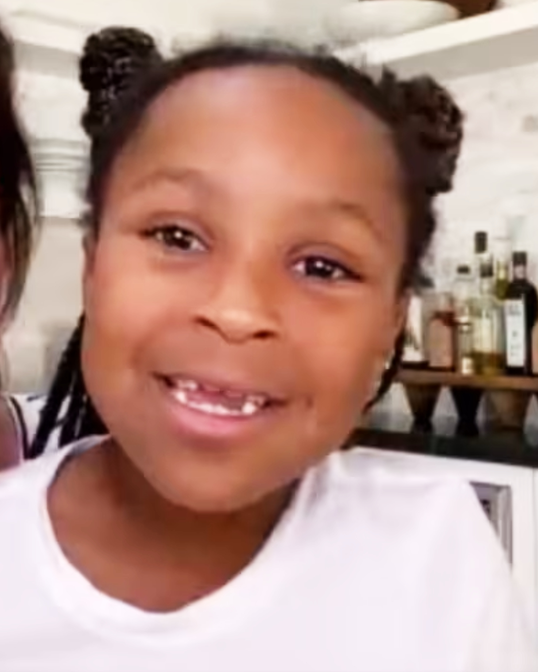 Laila smiling in her mom's lap as the two make an appearance on "Red Table Talk," posted May 8, 2020. | Source: Facebook/Red Table Talk