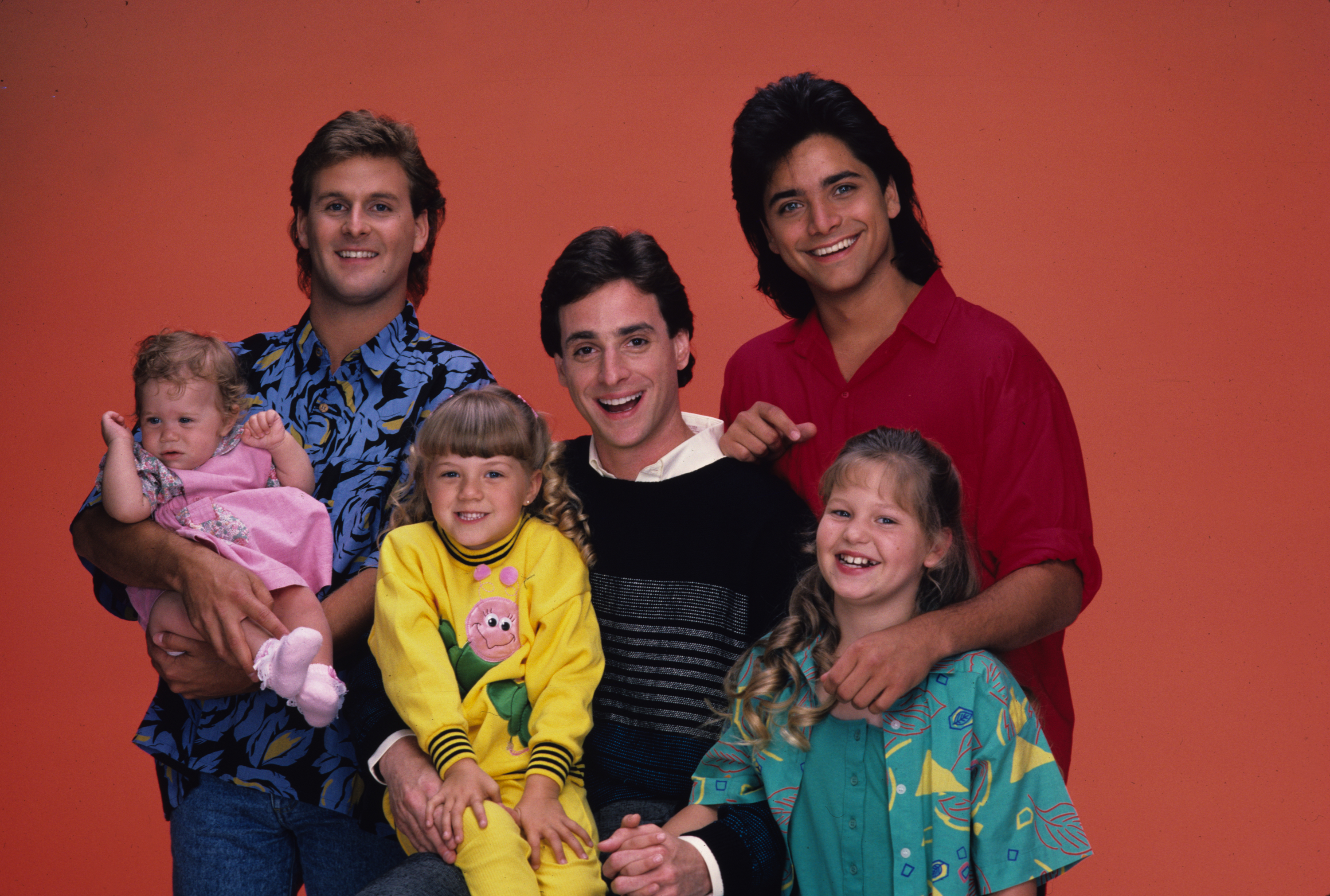 This early promotional photo introduced the cast that would become one of television's most beloved families. While audiences first watched the Tanner children grow up on screen, the actors behind them have since experienced everything from career reinventions to growing families and lives away from Hollywood. | Source: Getty Images