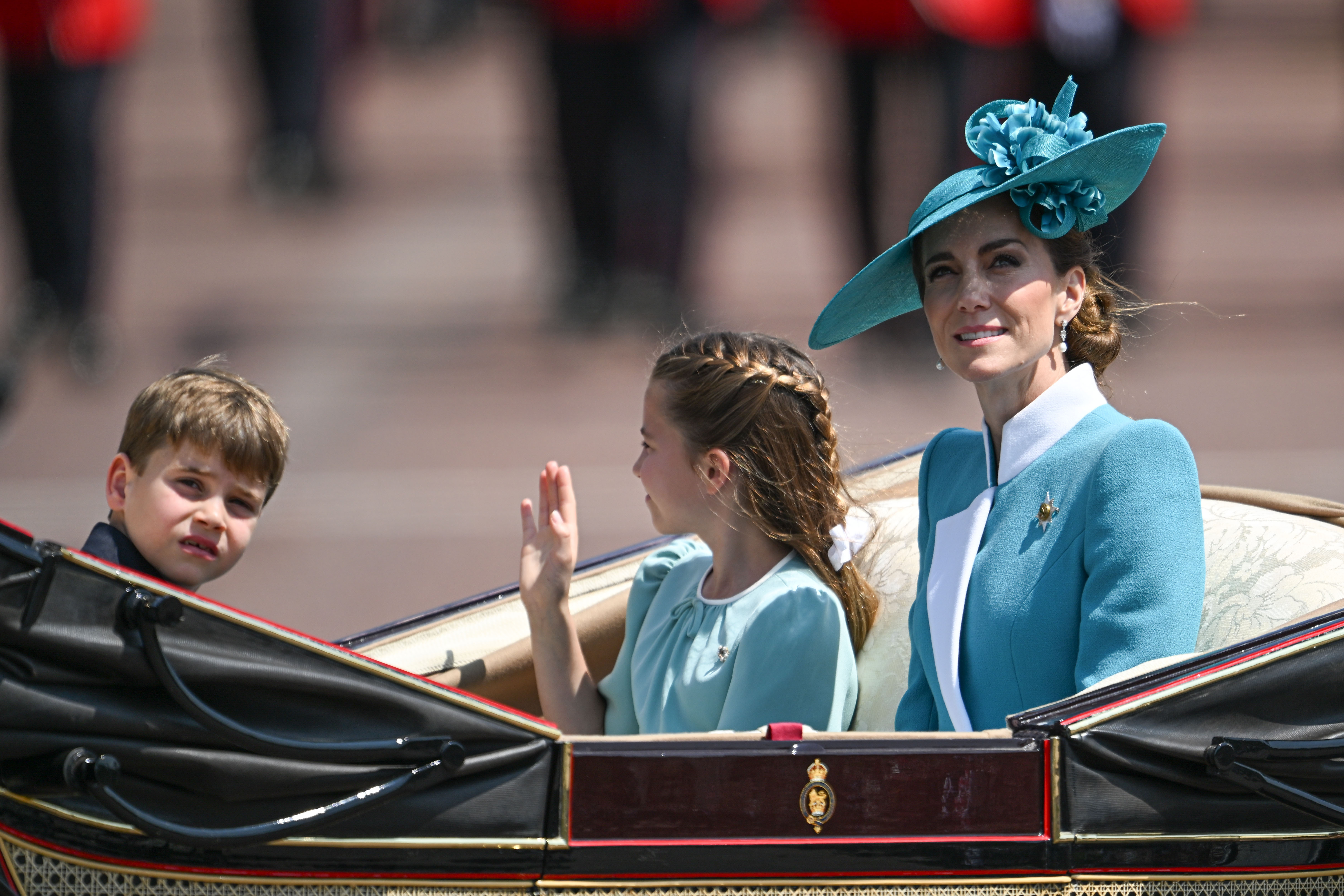 Princess Catherine, Princess Charlotte and Prince Louis attend the Trooping the Colour parade in London, exuding elegance and charm. Standing side by side, the royal mother and daughter share a poised presence amid the pageantry, capturing a graceful moment in the heart of the capital’s grand tradition.