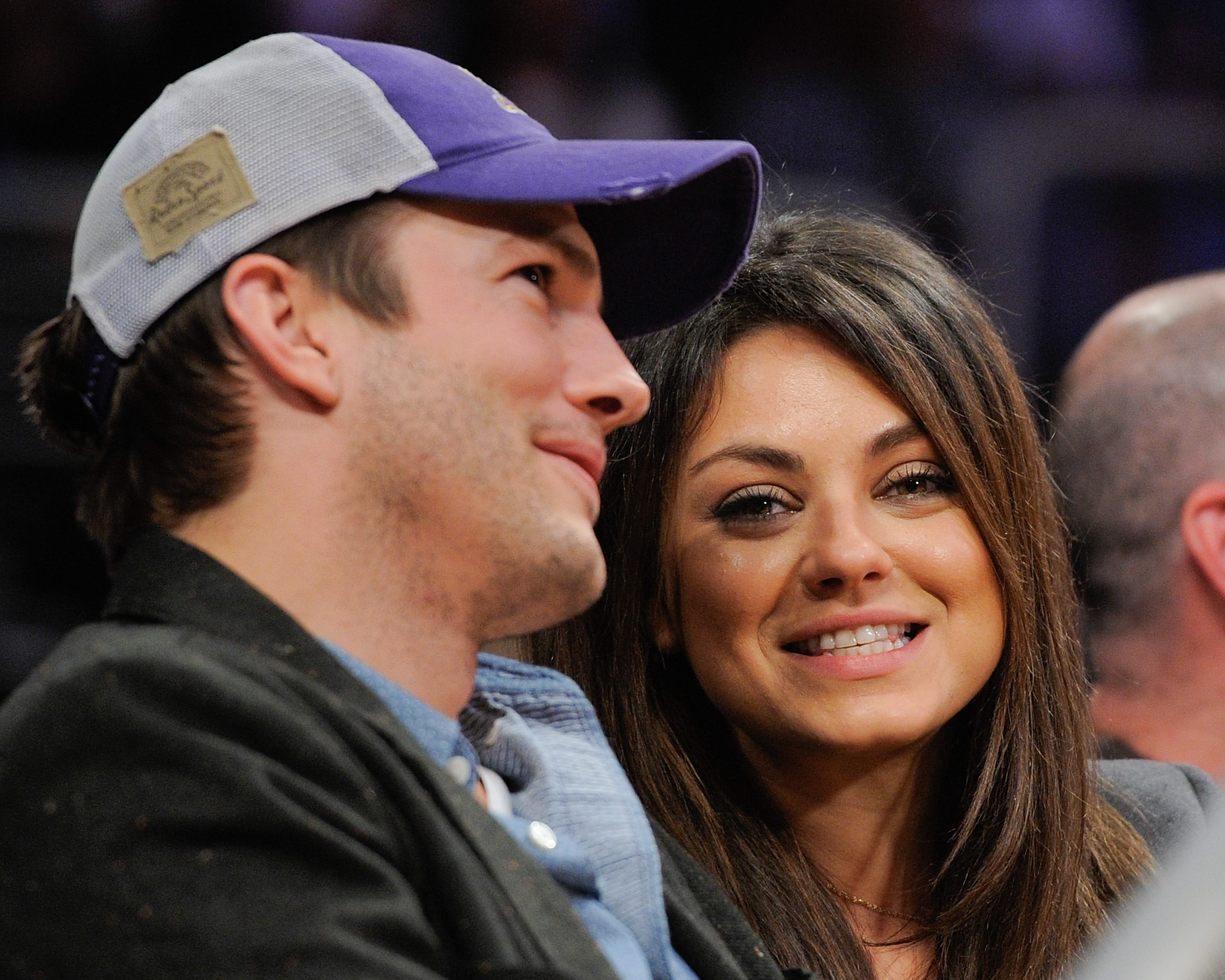 Ashton Kutcher and Mila Kunis attend a basketball game between the Utah Jazz and the Los Angeles Lakers at Staples Center on January 3, 2014, in Los Angeles, California. | Source: Getty Images