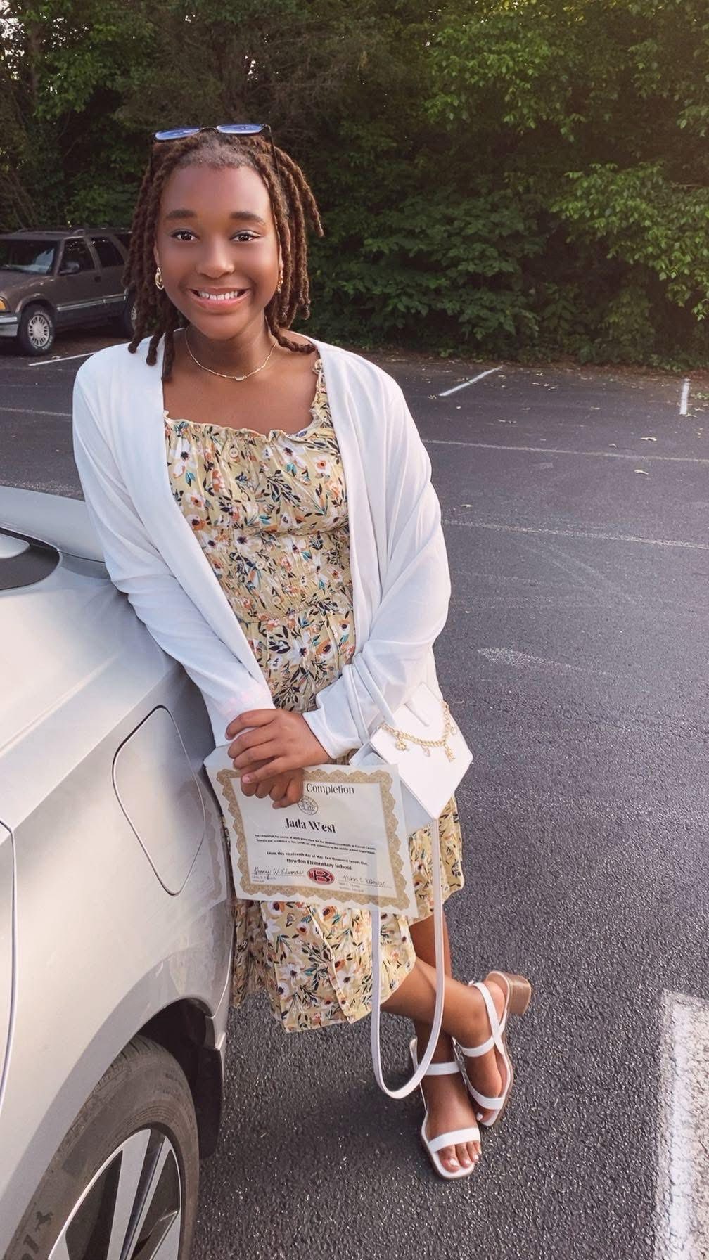 Jada West posing for a photo against a car, posted on November 19, 2025. | Source: Facebook/McClendon Rashunda
