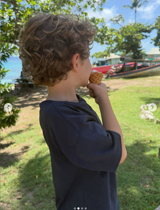 One of Richard Gere and Alejandra Silva’s children enjoys an ice cream cone near the beach during a sunny tropical getaway. | Source: Instagram/alejandragere