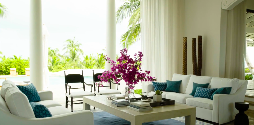 Interior Designer Ray Booth aimed to create a peaceful aesthetic that contrasted with the couple's busy professional lives. The decorative palette was inspired by the pale sand and vivid waters surrounding the property. | Source: YouTube/Architectural Digest