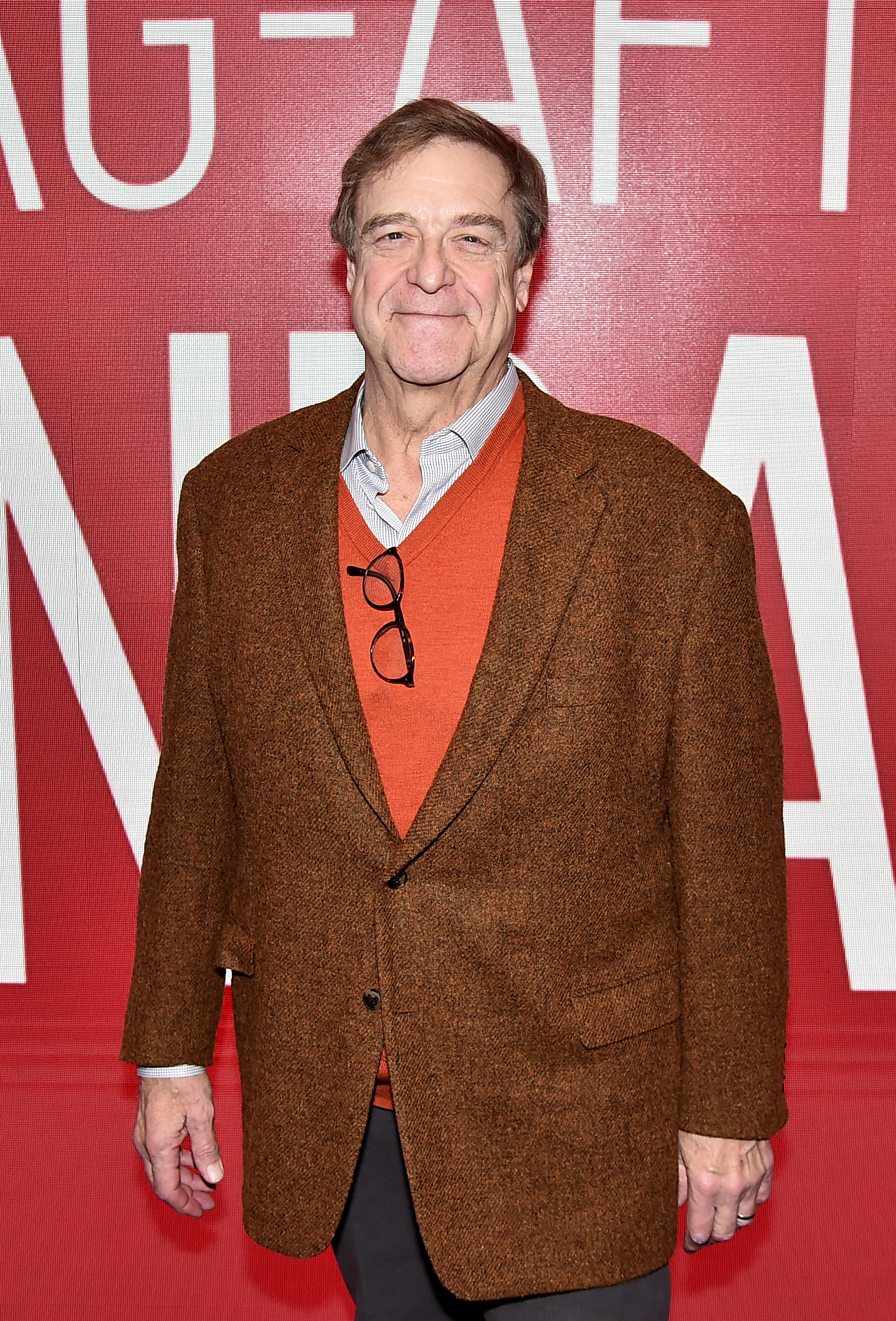 Goodman attended the SAG-AFTRA Foundation Conversations: "Black Earth Rising" at The Robin Williams Center in 2019 in New York City. He wore a gold coloured jacket over an orange vest. The top part of the white shirt worn under the vest sticks out. He sat his glasses on the orange vest.