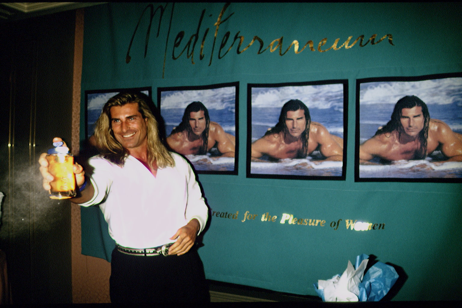 But book covers quickly led to partnerships with major luxury brands. In this photo, the iconic romance book cover star promoted the "Mediterraneum" fragrance created for him by Versace in New York, New York, on October 6, 1993. | Source: Getty Images