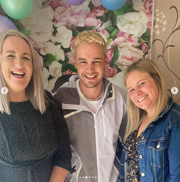 Liam Payne smiling with his sisters at a family event, surrounded by floral decor and balloons. | Source: Instagram/@np2788