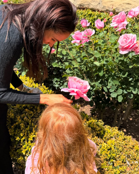 Meghan Markle and Princess Lilibet pictured in the garden | Source: X@marklercel