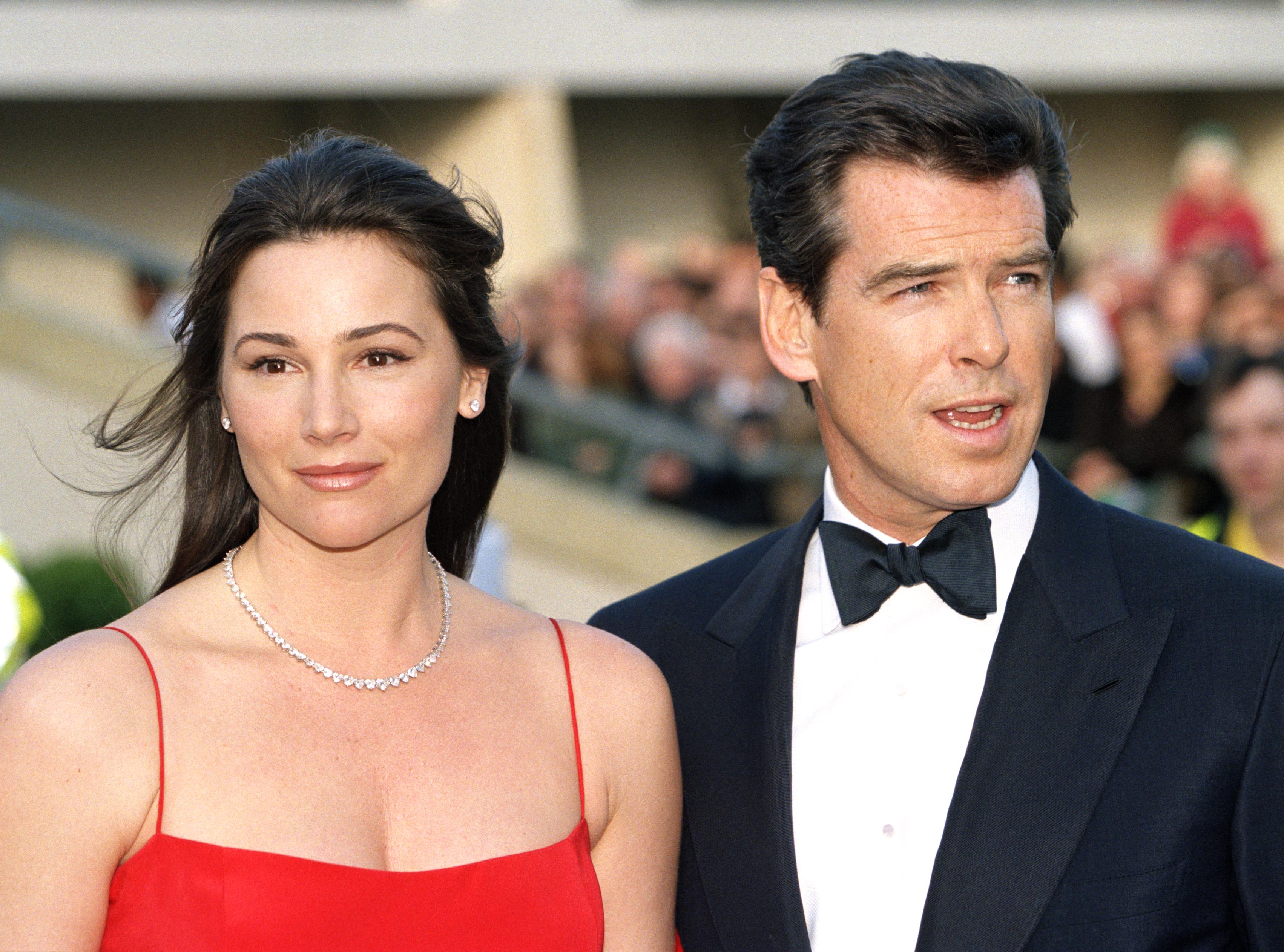 Pierce Brosnan and Keely Shaye Smith attend the 51st BAFTA Film Awards in London in 1999, years before welcoming their youngest son, Paris, whose latest red-carpet appearance has fans debating which parent he resembles most. | Source: Getty Images
