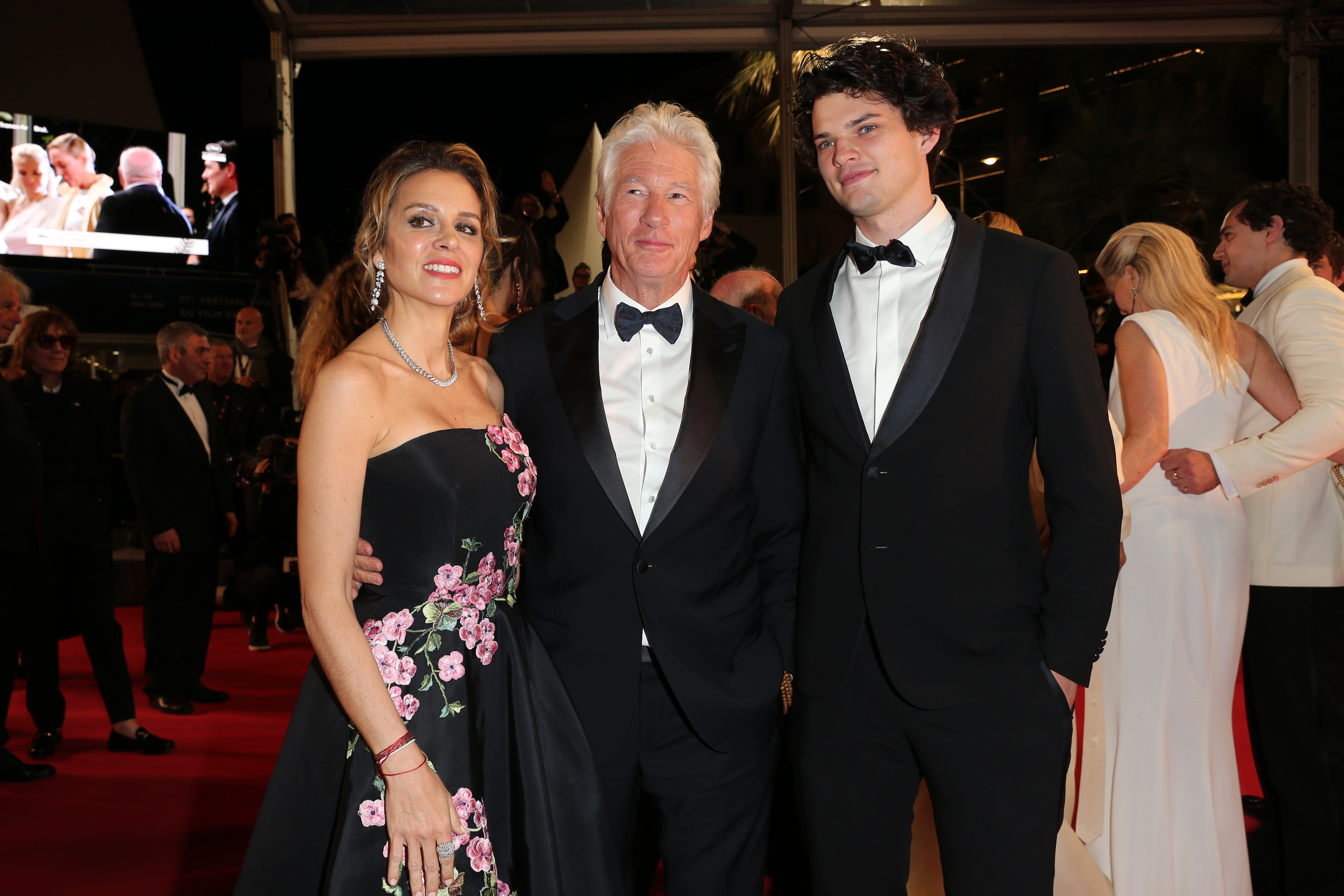 Alejandra Silva, Richard Gere, and Homer James Jigme Gere on the "Oh, Canada" red carpet during the 77th annual Cannes Film Festival in Cannes, France on May 17, 2024 | Source: Getty Images