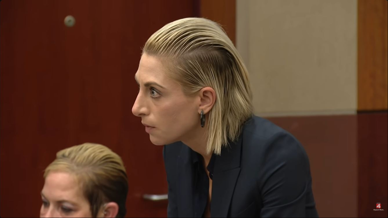 Scott's lawyer leaned forward during the proceedings, revealing the swept-back hairstyle that sparked comparisons with the rapper's ex-wife. Scott could be seen seated in the foreground with her own short blonde hair similarly combed away from her face, a visual coincidence that became a recurring theme in reactions to the court footage. | Source: YouTube/Click On Detroit | Local 4 | WDIV