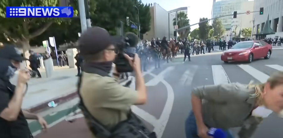 Lauren Tomasi after being shot in the leg in Downtown Los Angeles during confrontations between the U.S. National Guard and protestors on June 8, 2025 | Source: Youtube/9 News Australia