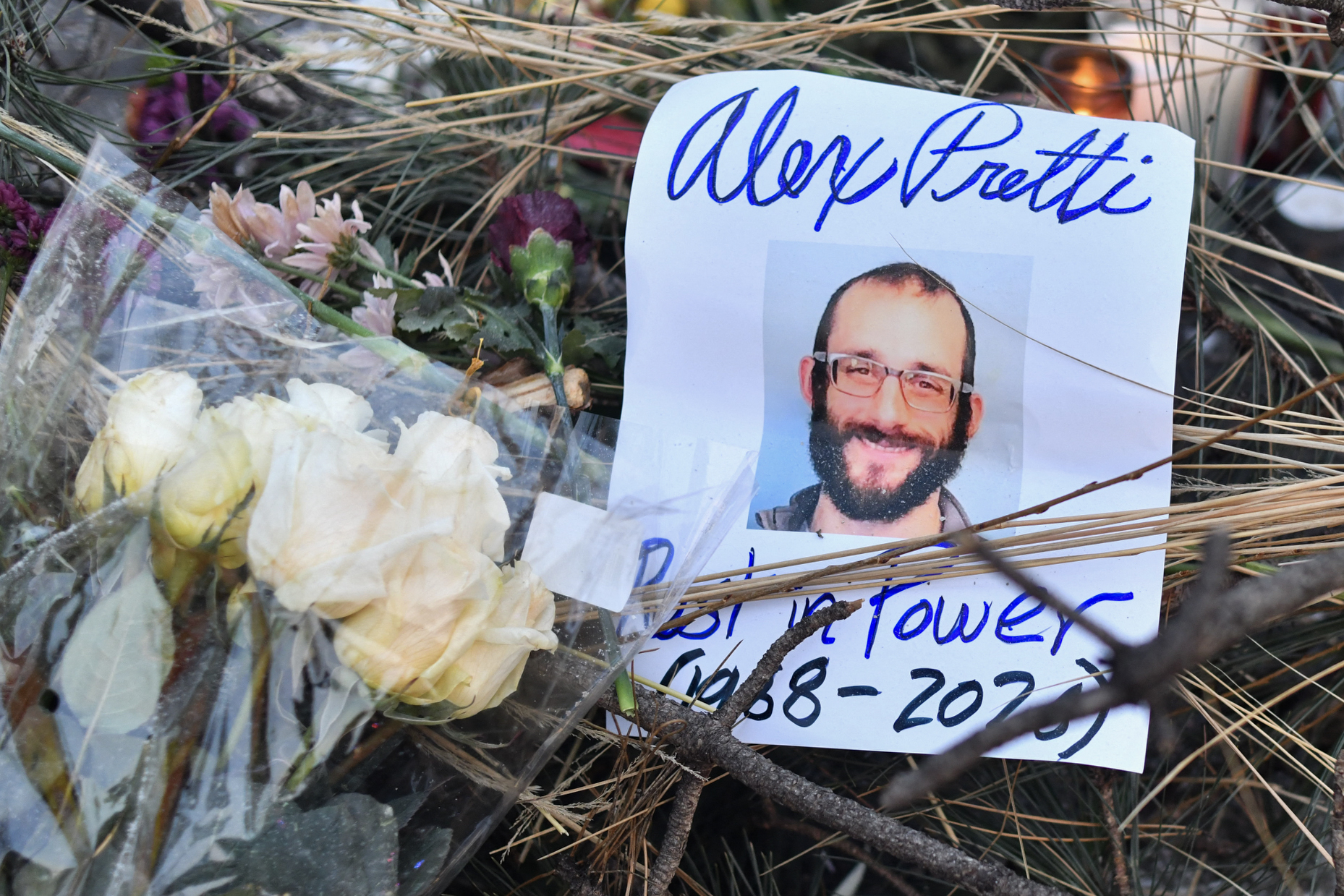 Flowers are left at a makeshift memorial in the area where Alex Pretti was shot a day earlier by federal immigration agents on January 25, 2026, in Minneapolis, Minnesota | Source: Getty Images
