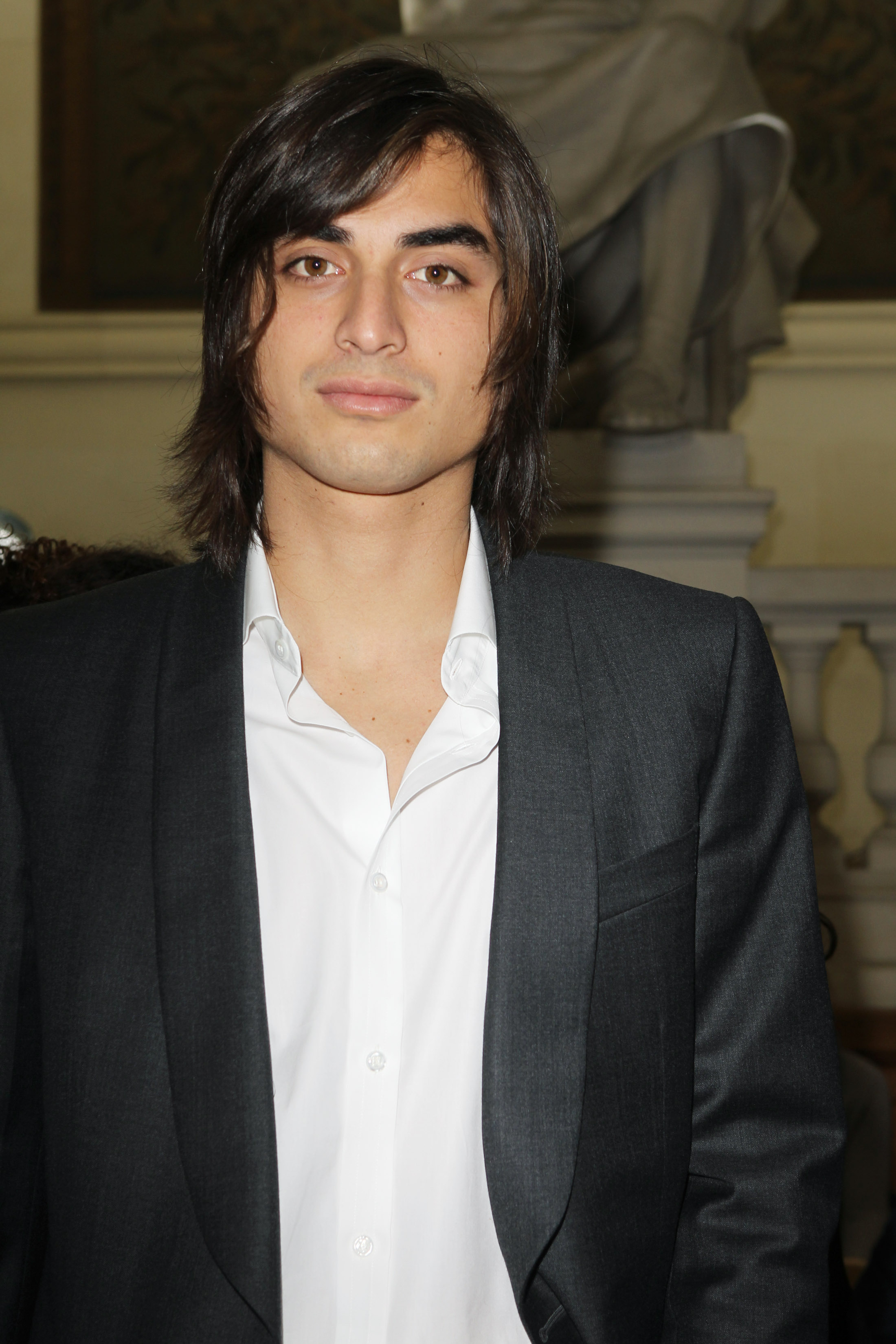 Tuki Brando attends the Yves Saint Laurent Menswear Autumn/Winter 2013 show at La Sorbonne during Paris Fashion Week in France on January 20, 2012. Having built a successful modeling career, he became known for work with luxury fashion houses while forging an identity beyond his family's Hollywood legacy.
