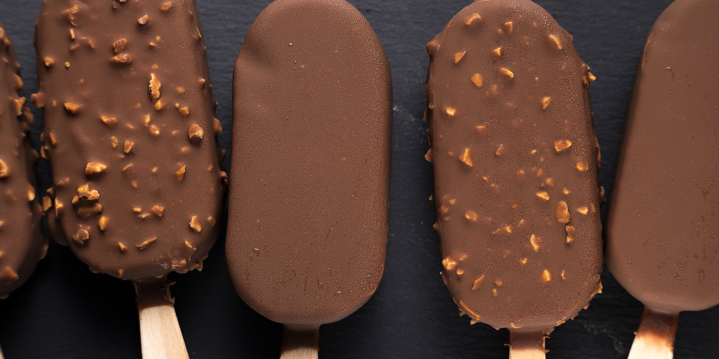 Chocolate ice creams on sticks | Source: Getty Images