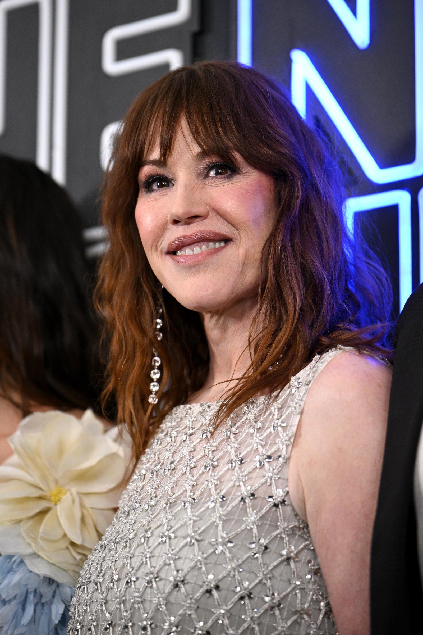 Ringwald's shimmering silver beaded dress became one of the standout looks of the evening. As new photos emerged online, many fans focused on her evolving appearance, prompting a wide range of reactions across social media.