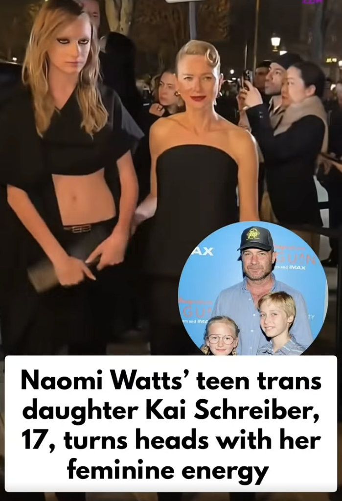 Kai’s cropped black top and low-rise trousers create a bold, fashion-forward look. Naomi Watts walks beside her as cameras flash from the crowd. | Source: Facebook/IWMBuzz
